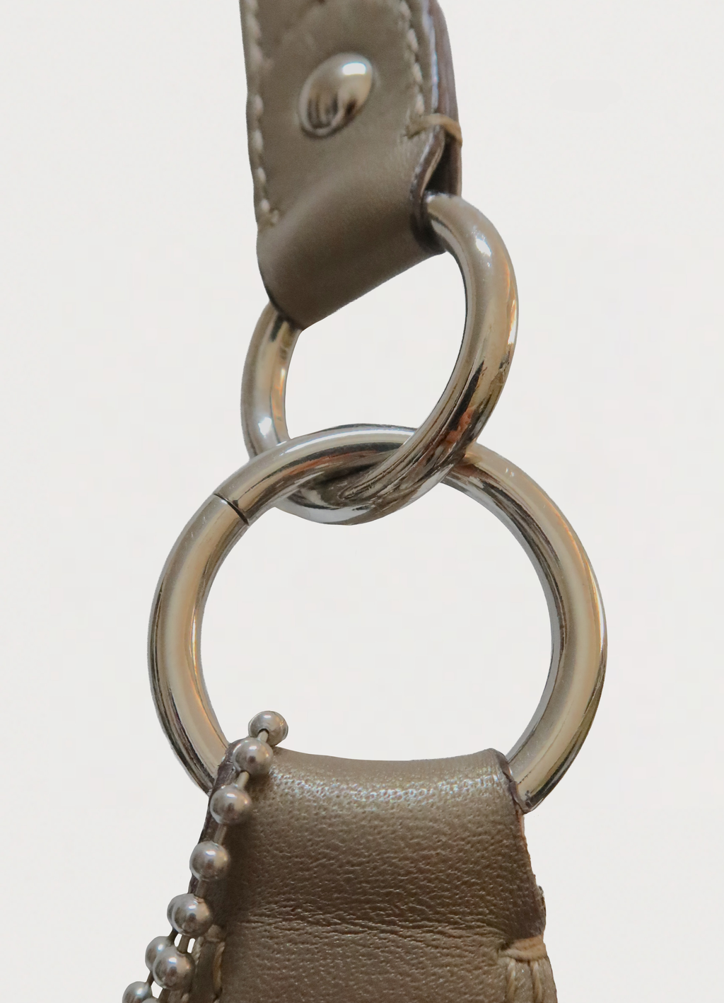 STITCHED SIGNATURE METALLIC HOBO SHOULDER BAG
