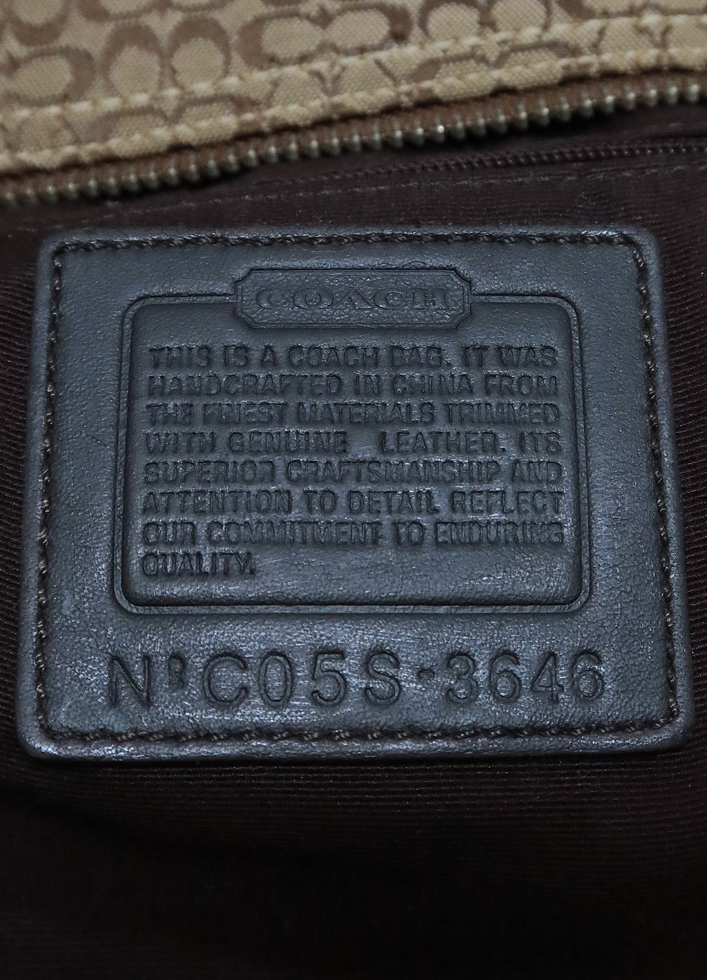 SIGNATURE SOHO BUCKLE HANDBAG