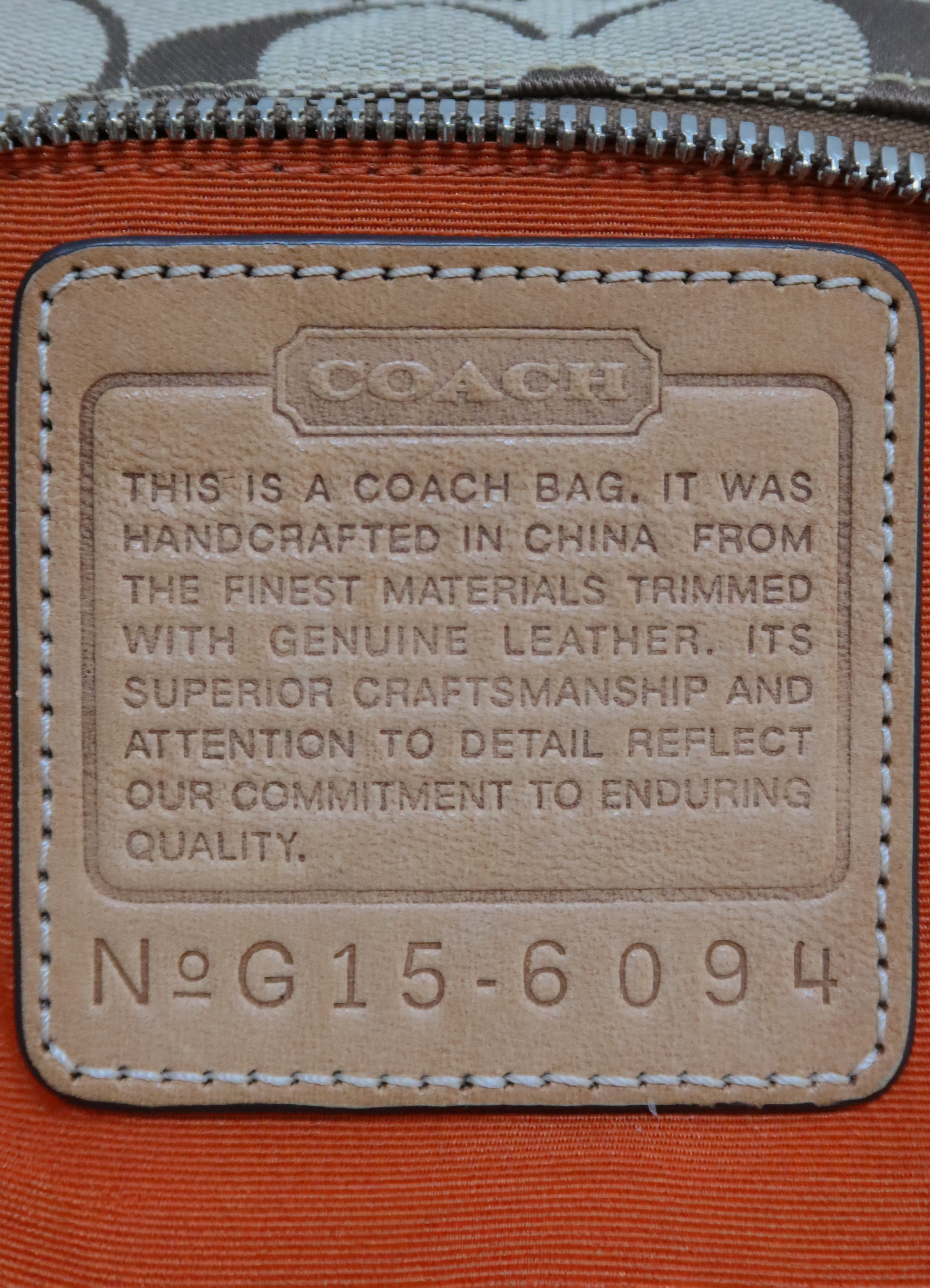 SIGNATURE DEMI POCHETTE BAG