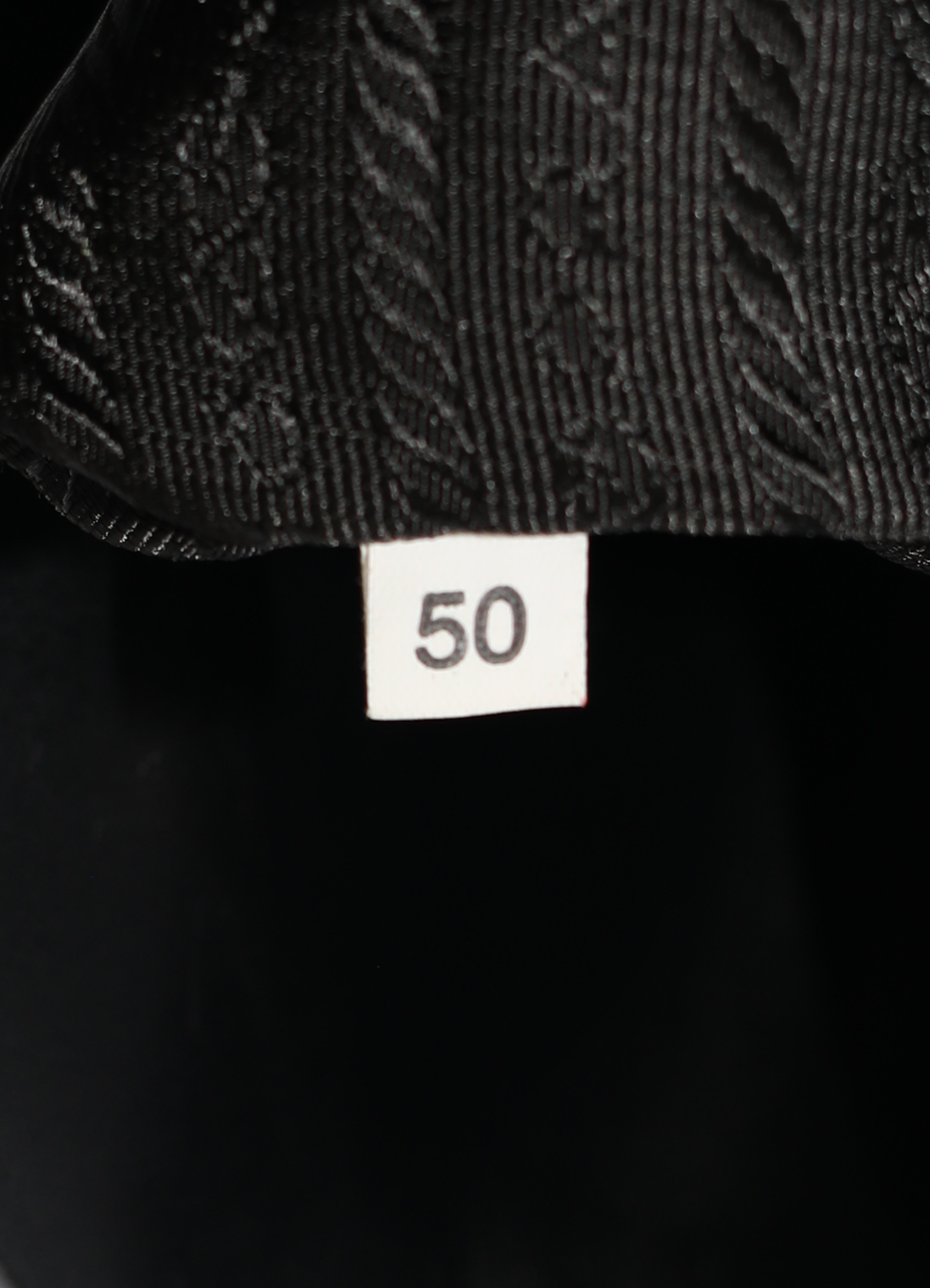 Vintage Prada Spazzolato Chic Shoulder Bag patent leather showing close up of label number
