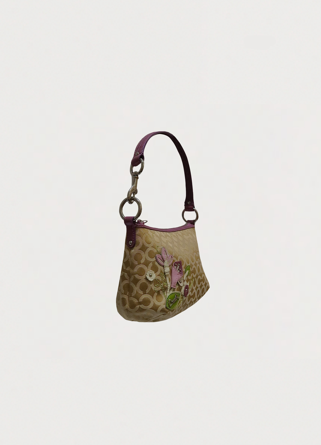 Vintage coach purple mixed op art monogram pochette bag showing angled side