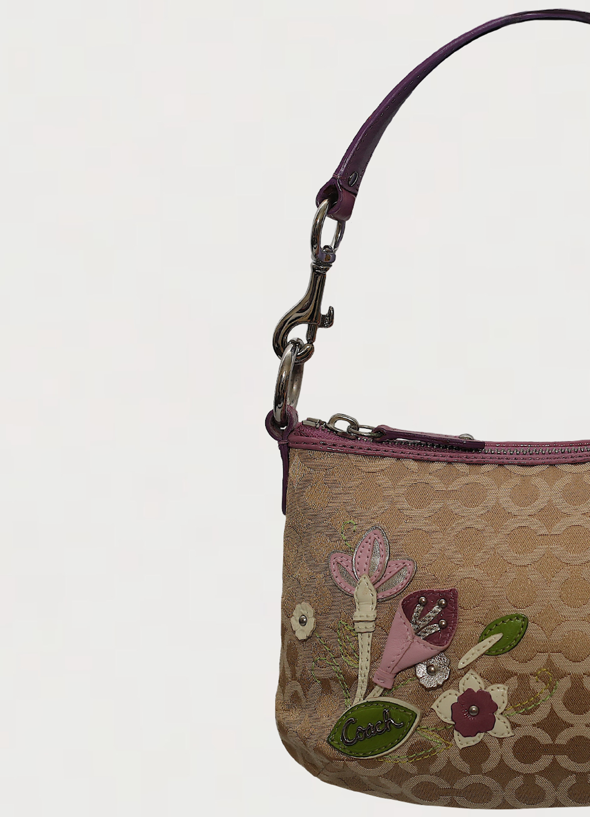 Vintage coach purple mixed op art monogram pochette bag showing close up of leather detailing