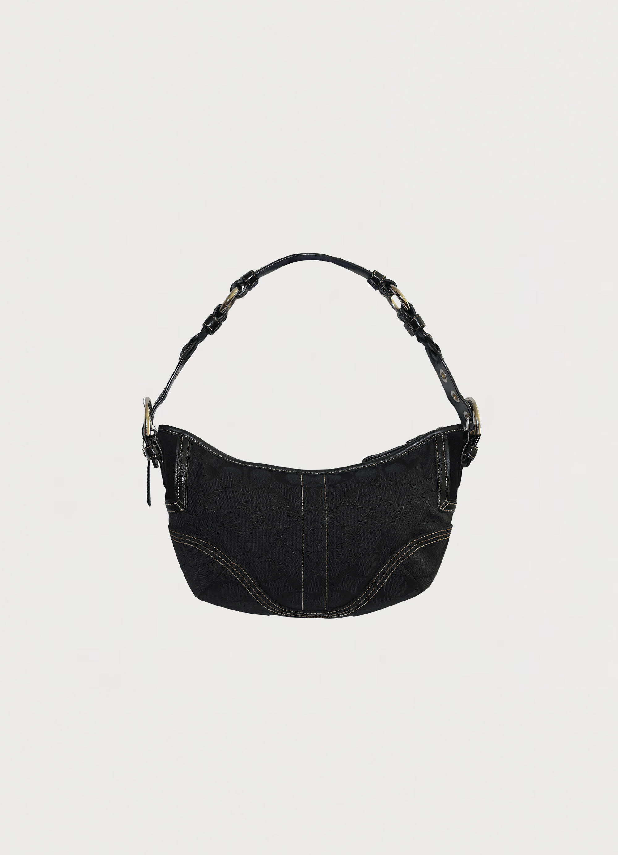 Vintage Coach Soho hobo bag in black signature canvas with leather trim showing back