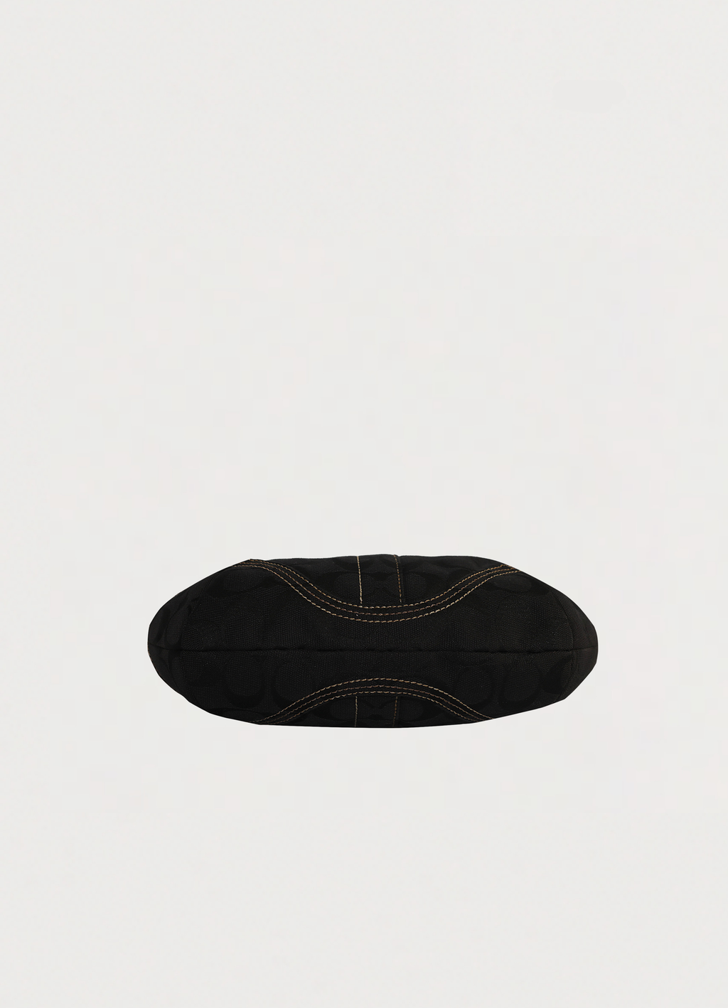 Vintage Coach Soho hobo bag in black signature canvas with leather trim showing base