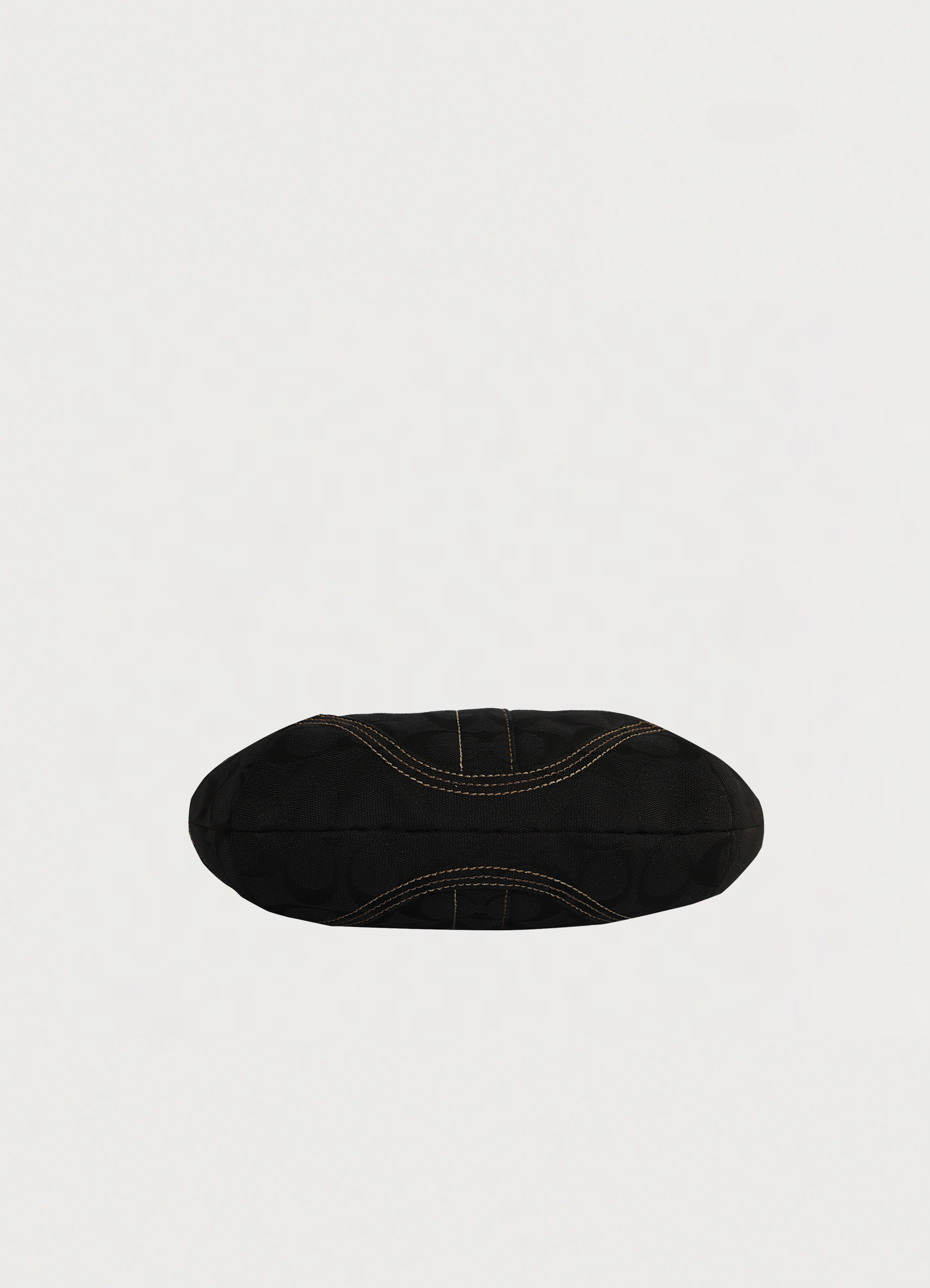 Vintage Coach Soho hobo bag in black signature canvas with leather trim showing base