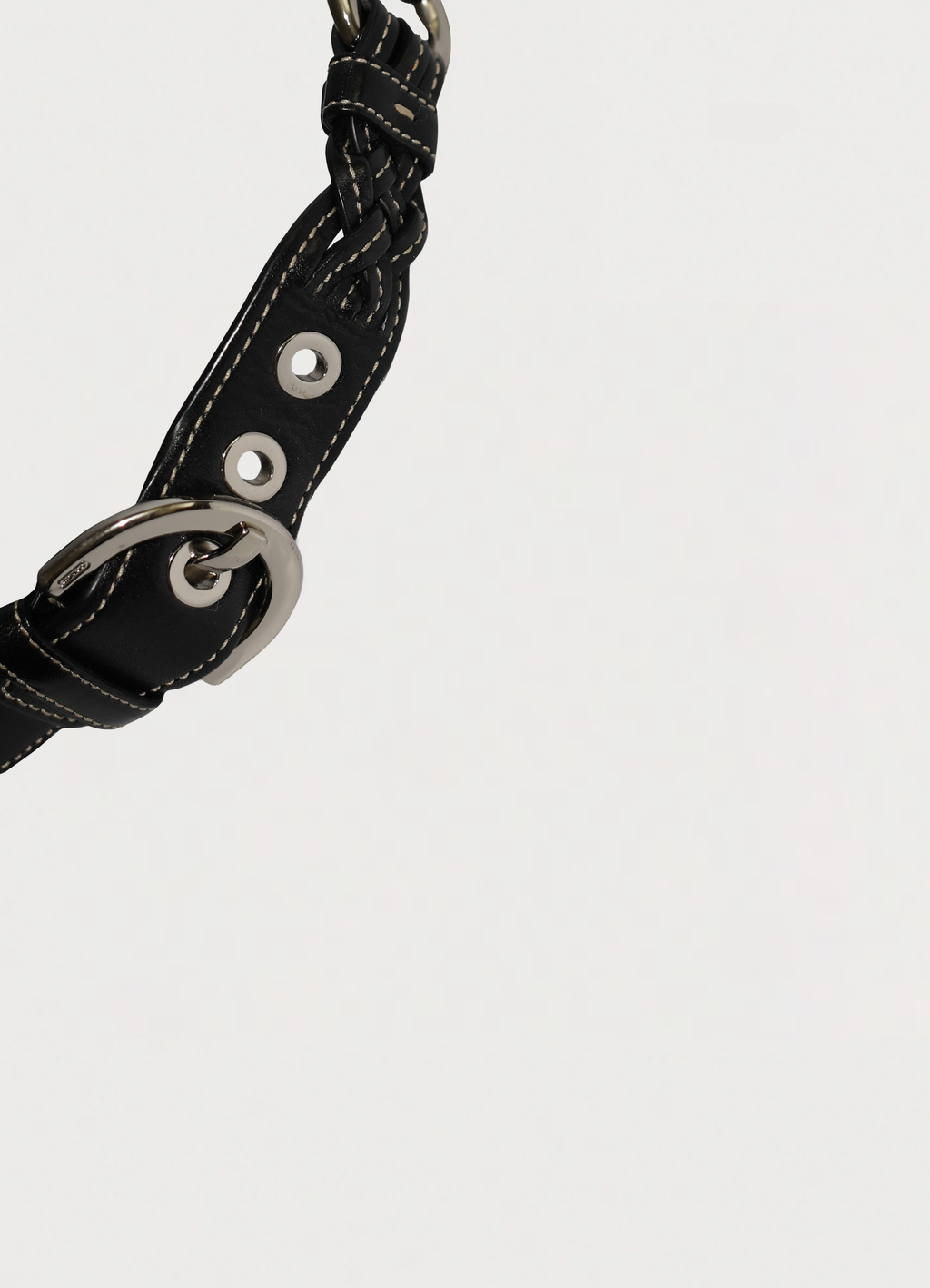 Vintage Coach Soho hobo bag in black signature canvas with leather trim showing close up of strap