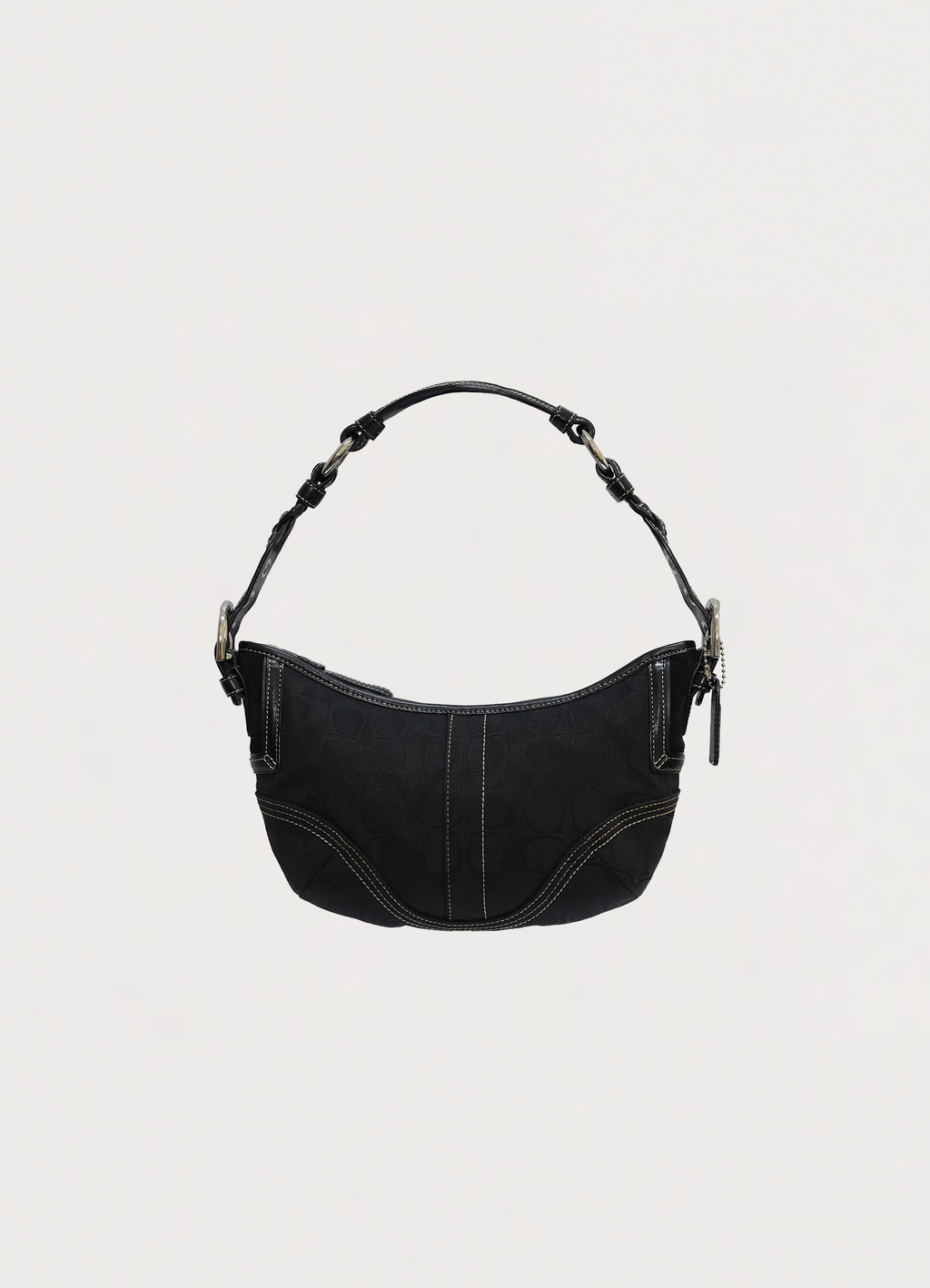 Vintage Coach Soho hobo bag in black signature canvas with leather trim showing front