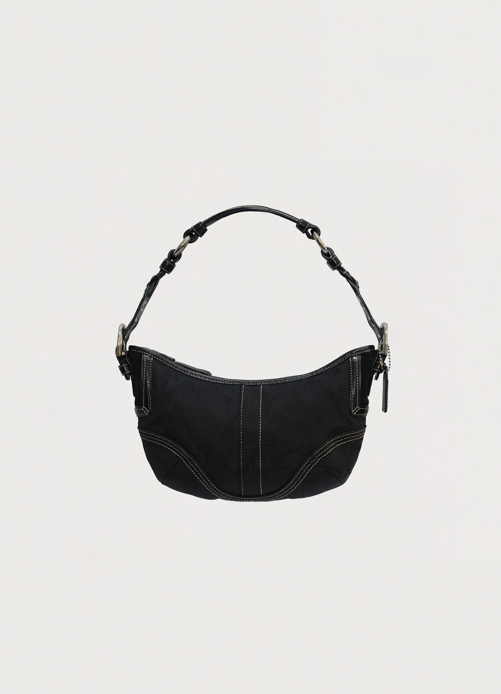 Vintage Coach Soho hobo bag in black signature canvas with leather trim showing front