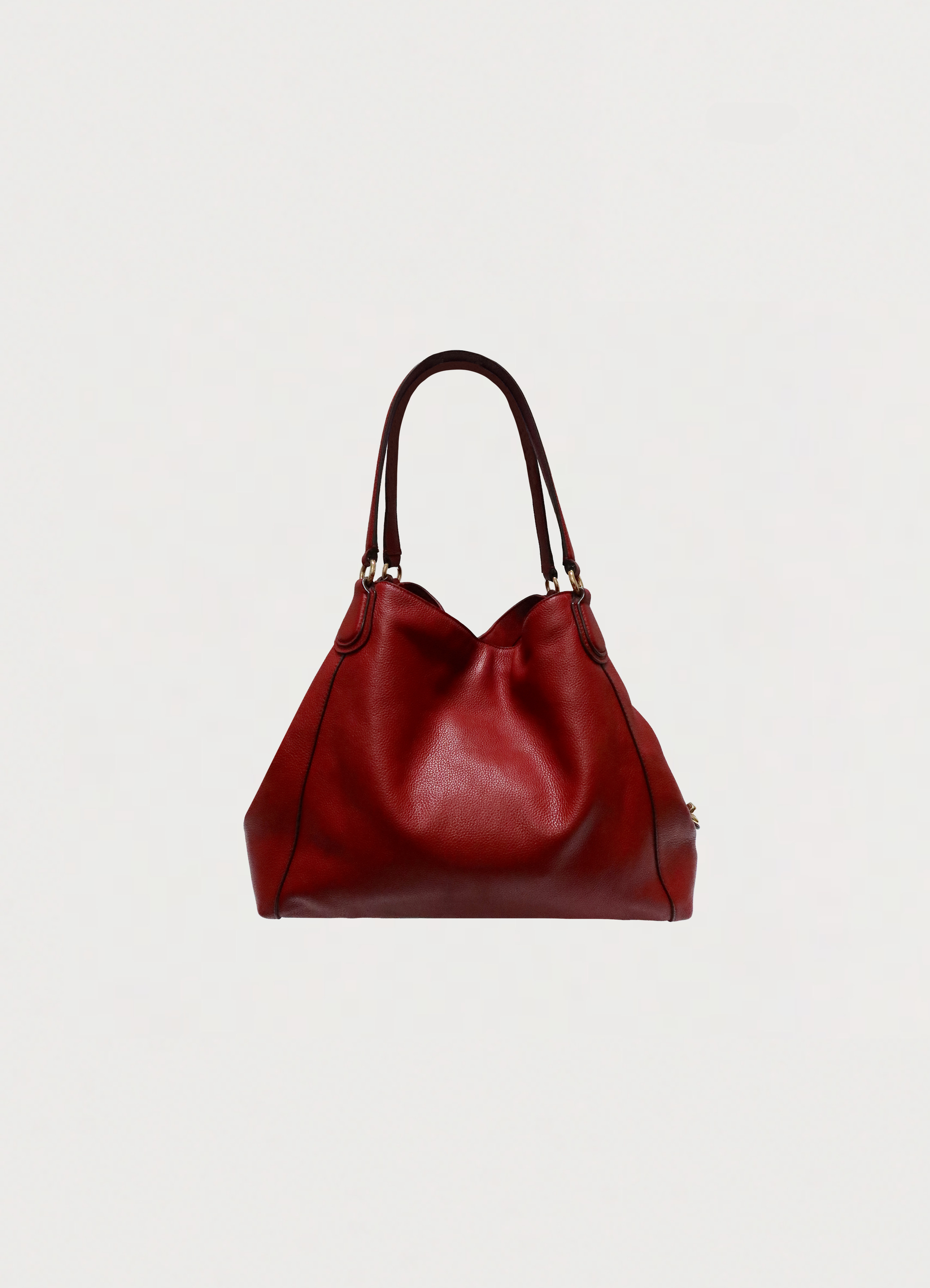 Back view of Coach Edie 31 shoulder bag in red polished pebble leather