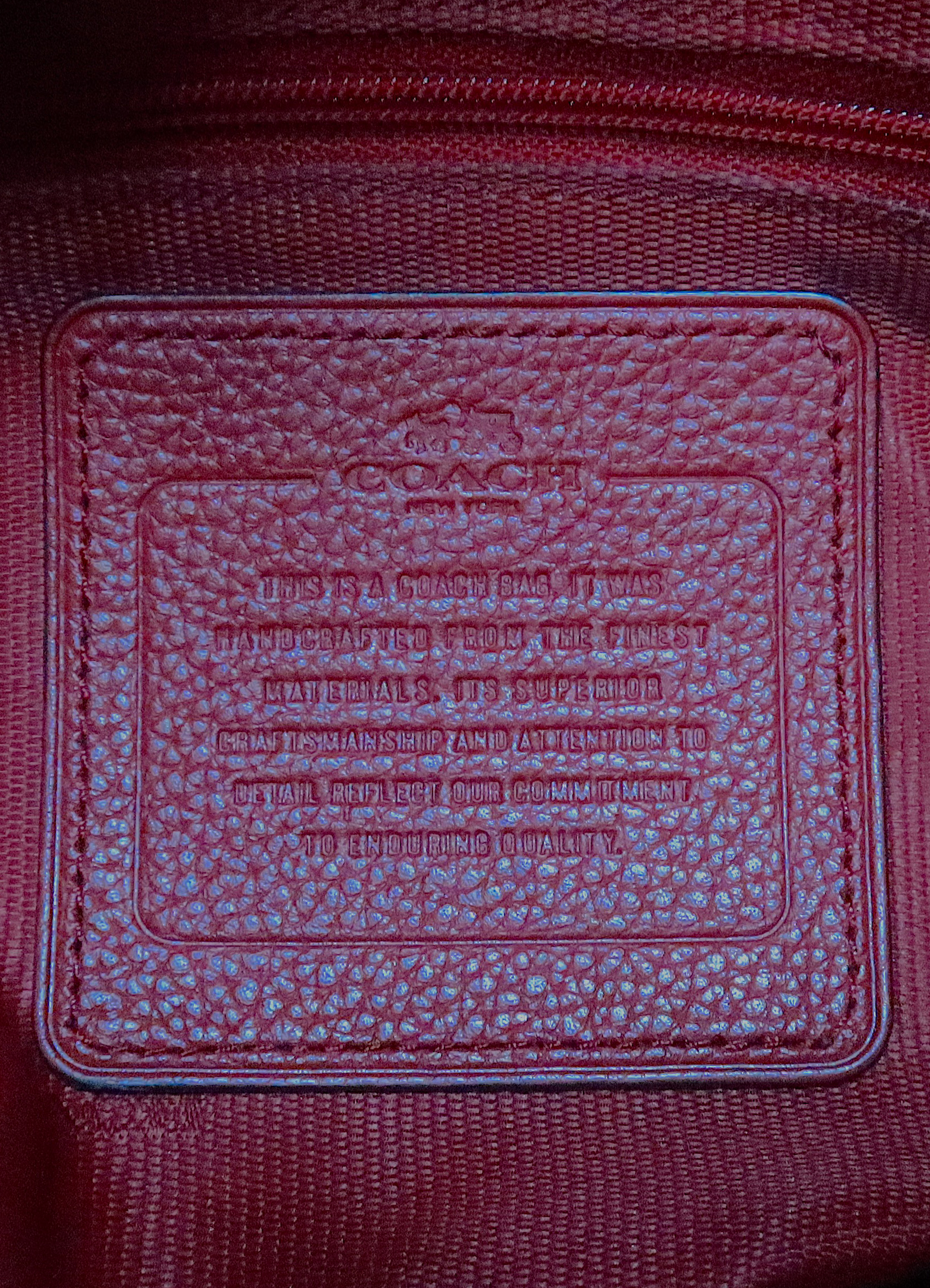 Interior leather Coach creed patch in red for authenticity