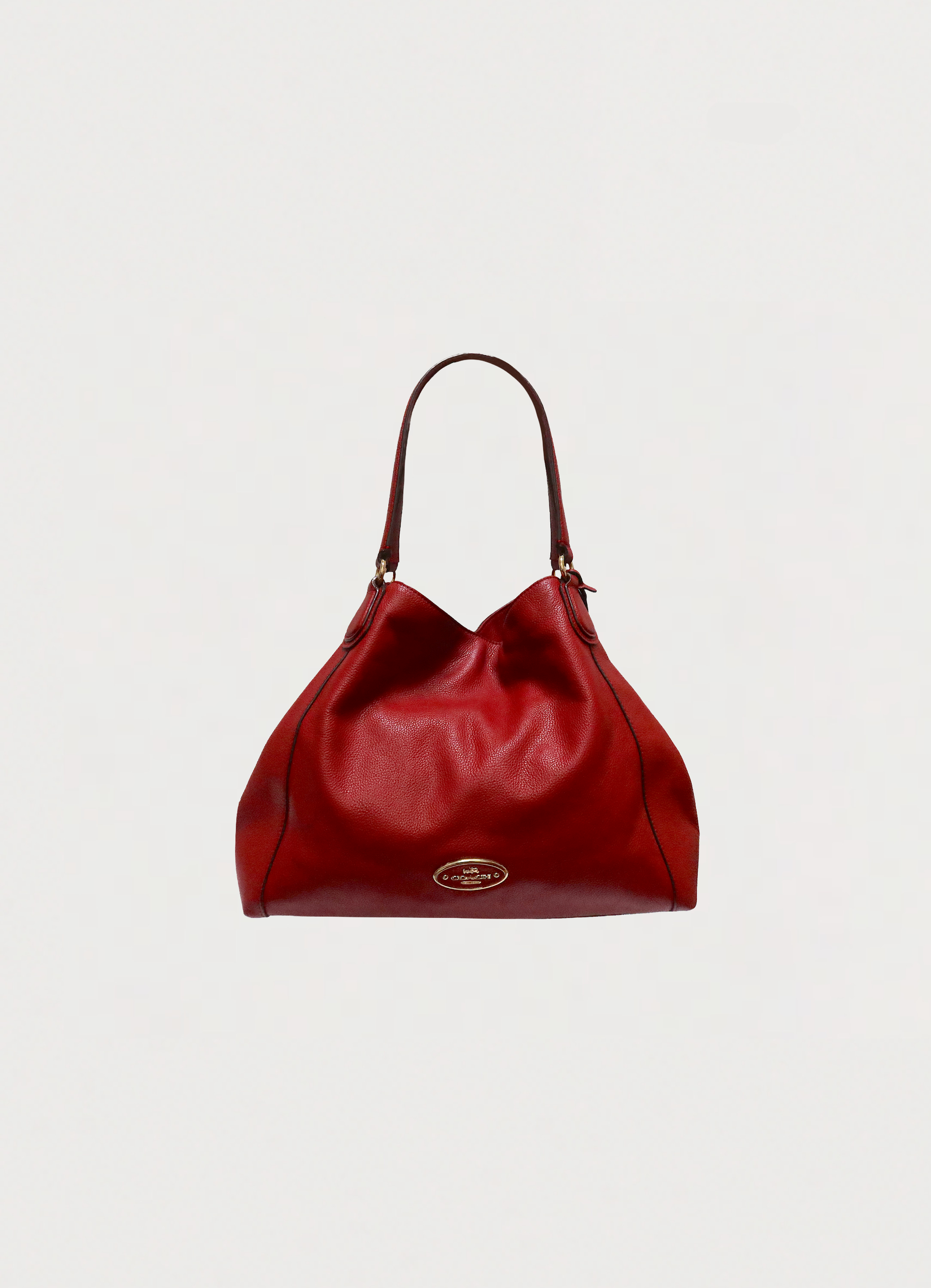 Front view of Coach Edie 31 shoulder bag in red polished pebble leather