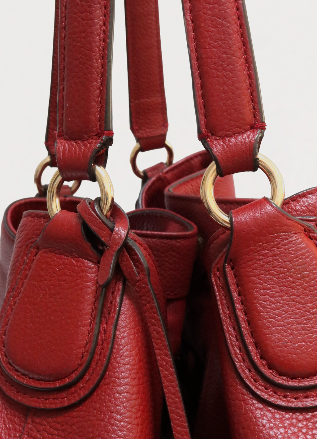 Close up of the hardware and lobster clasp closure on the Coach Edie interior