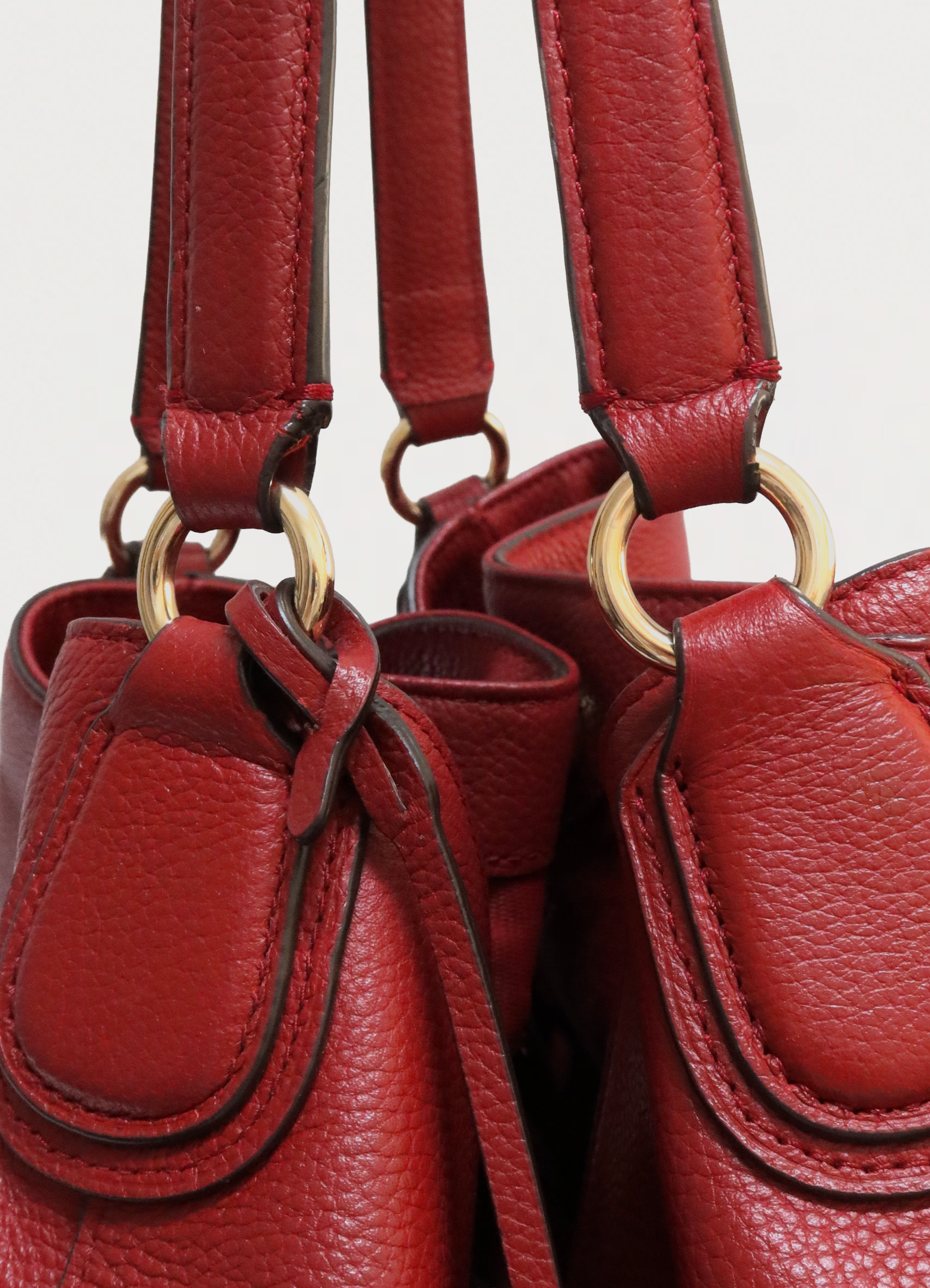 Close up of the hardware and lobster clasp closure on the Coach Edie interior