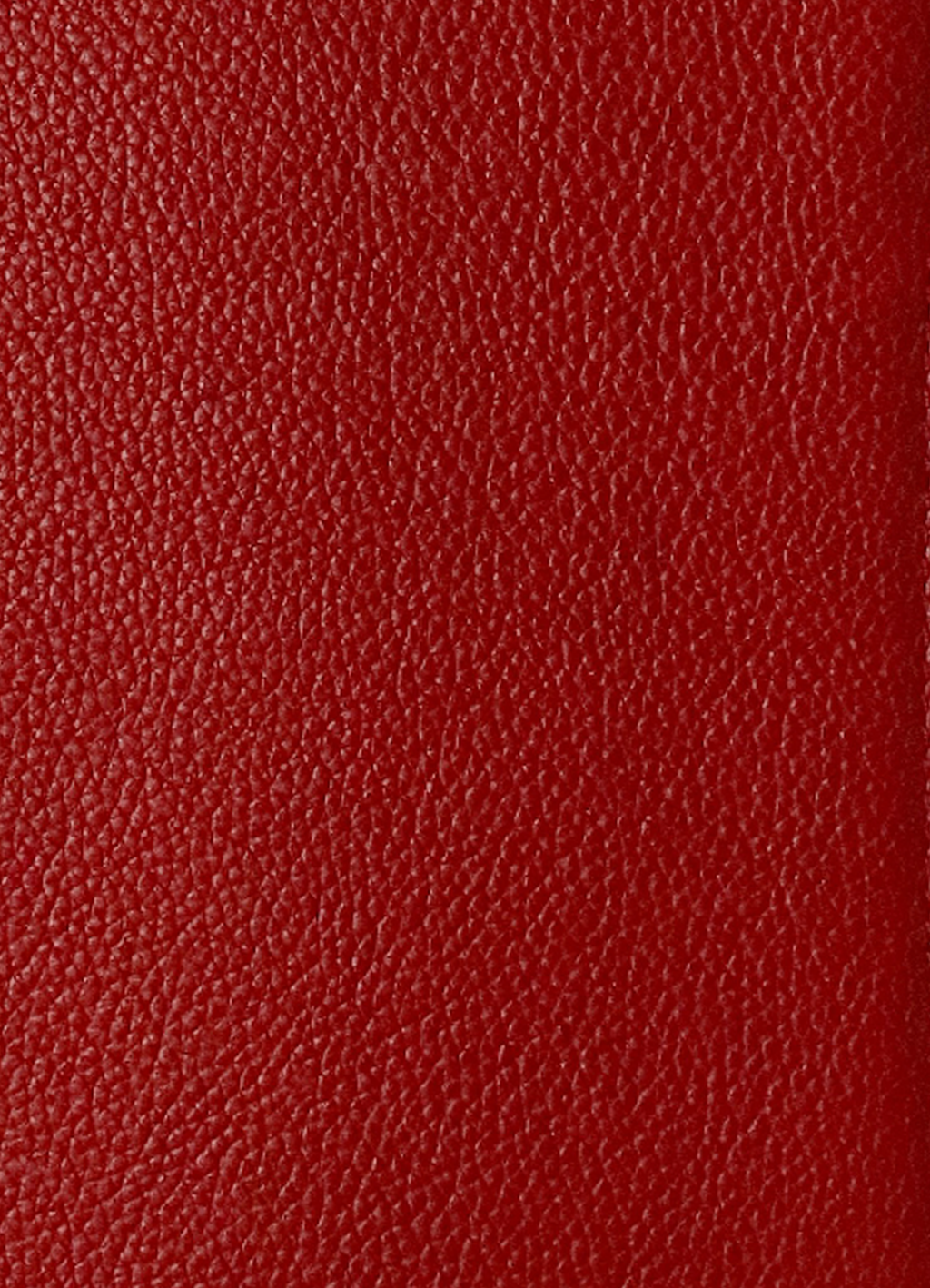 Macro shot of authentic Coach red polished pebble leather grain