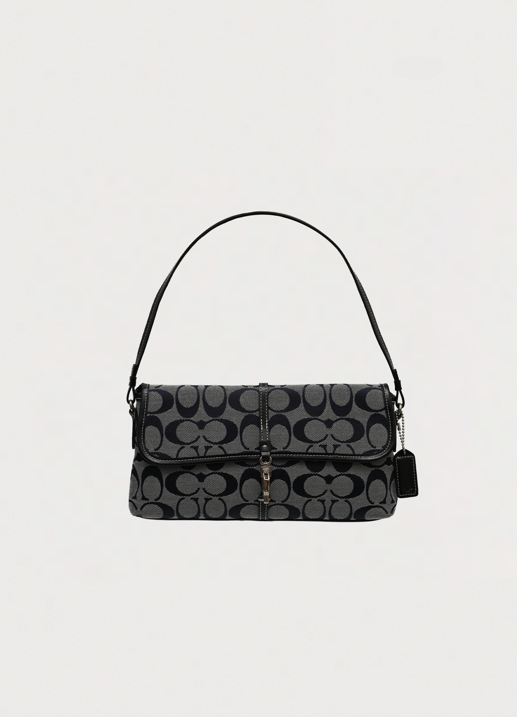 Coach signature demi flap bag in black and grey canvas with front lobster clip closure front view