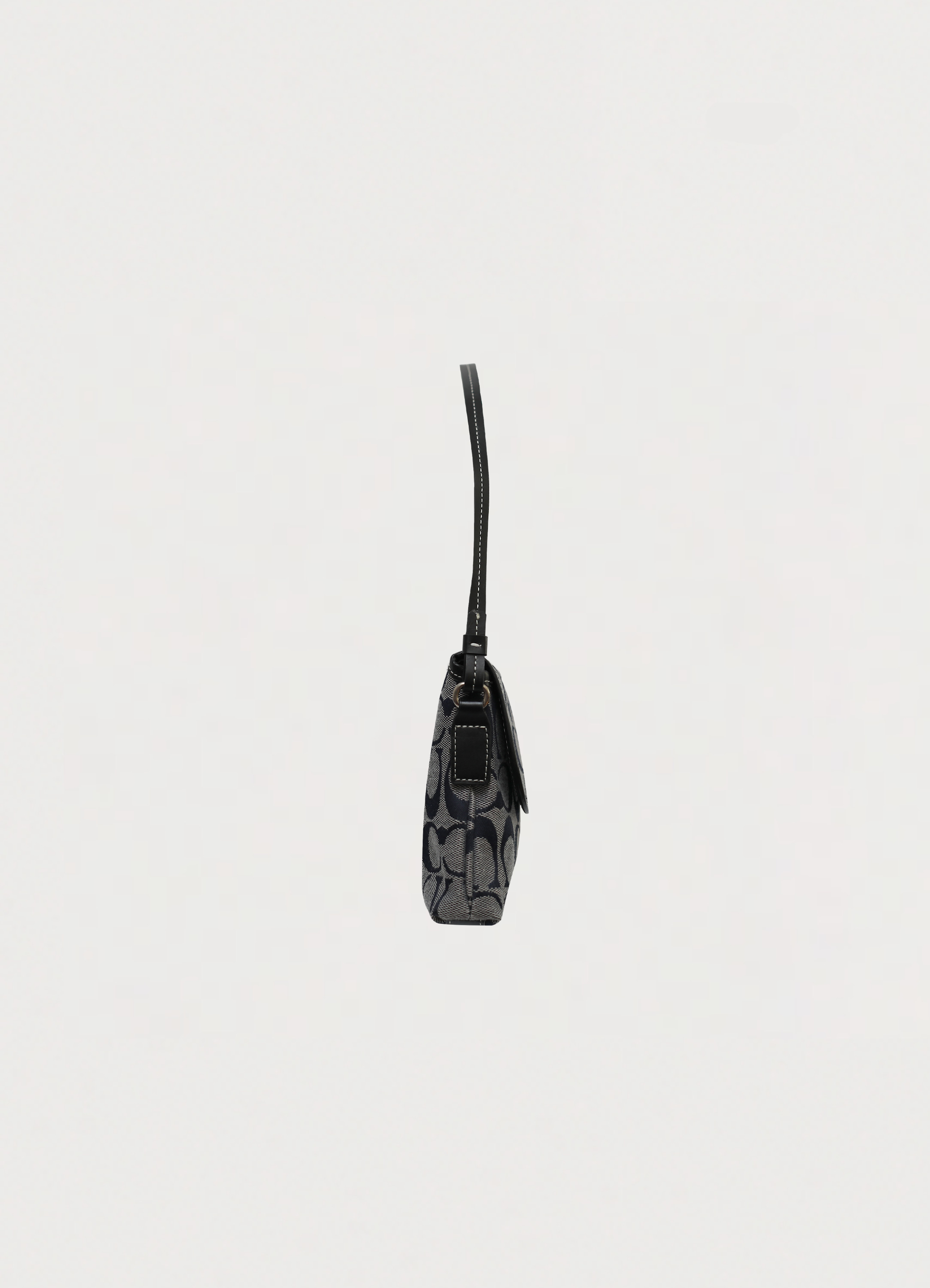 Right side profile of black and grey Coach signature demi shoulder bag
