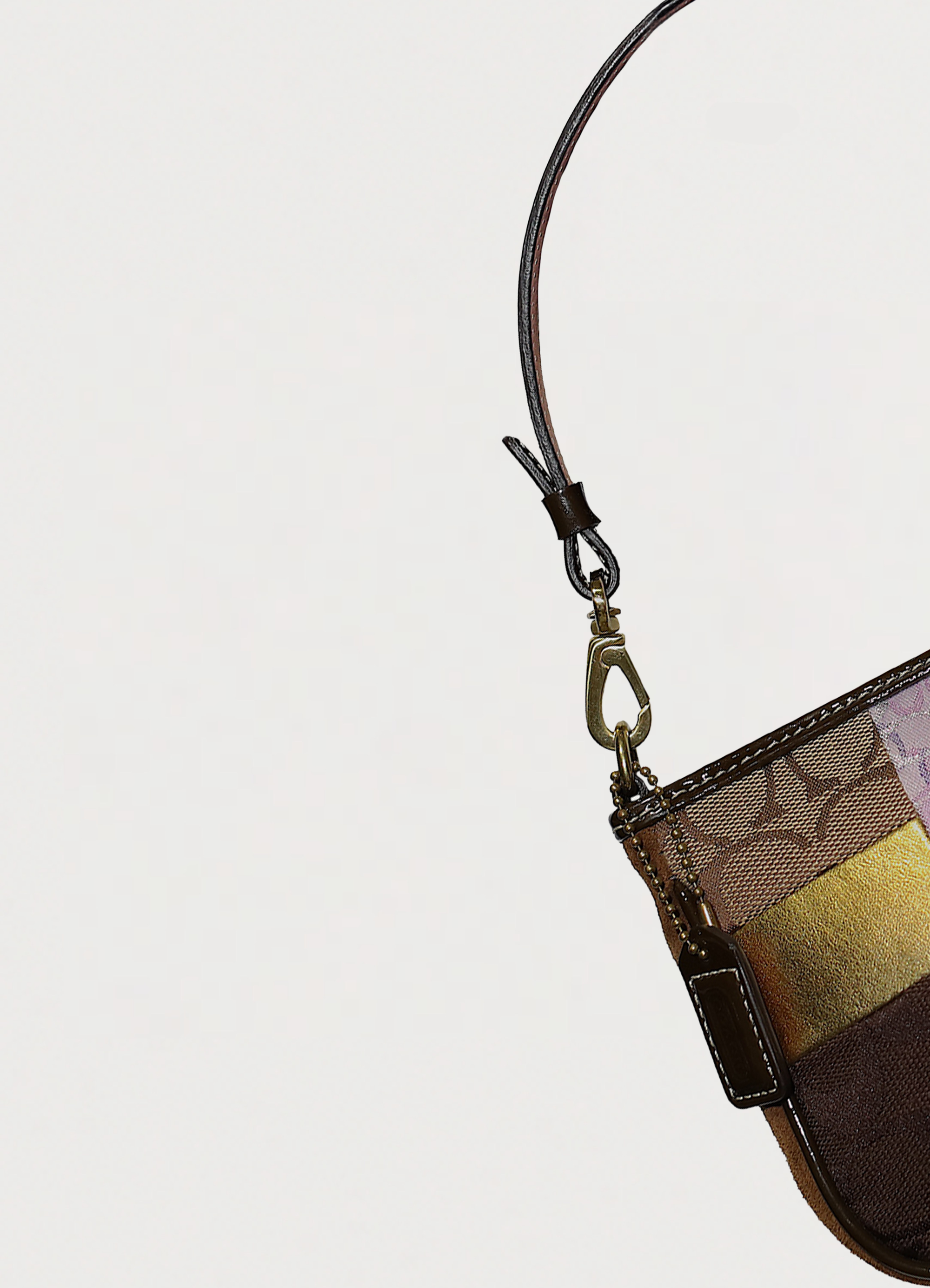 Coach legacy patchwork demi pochette handbag in multi patchwork print showing close up of hang tag