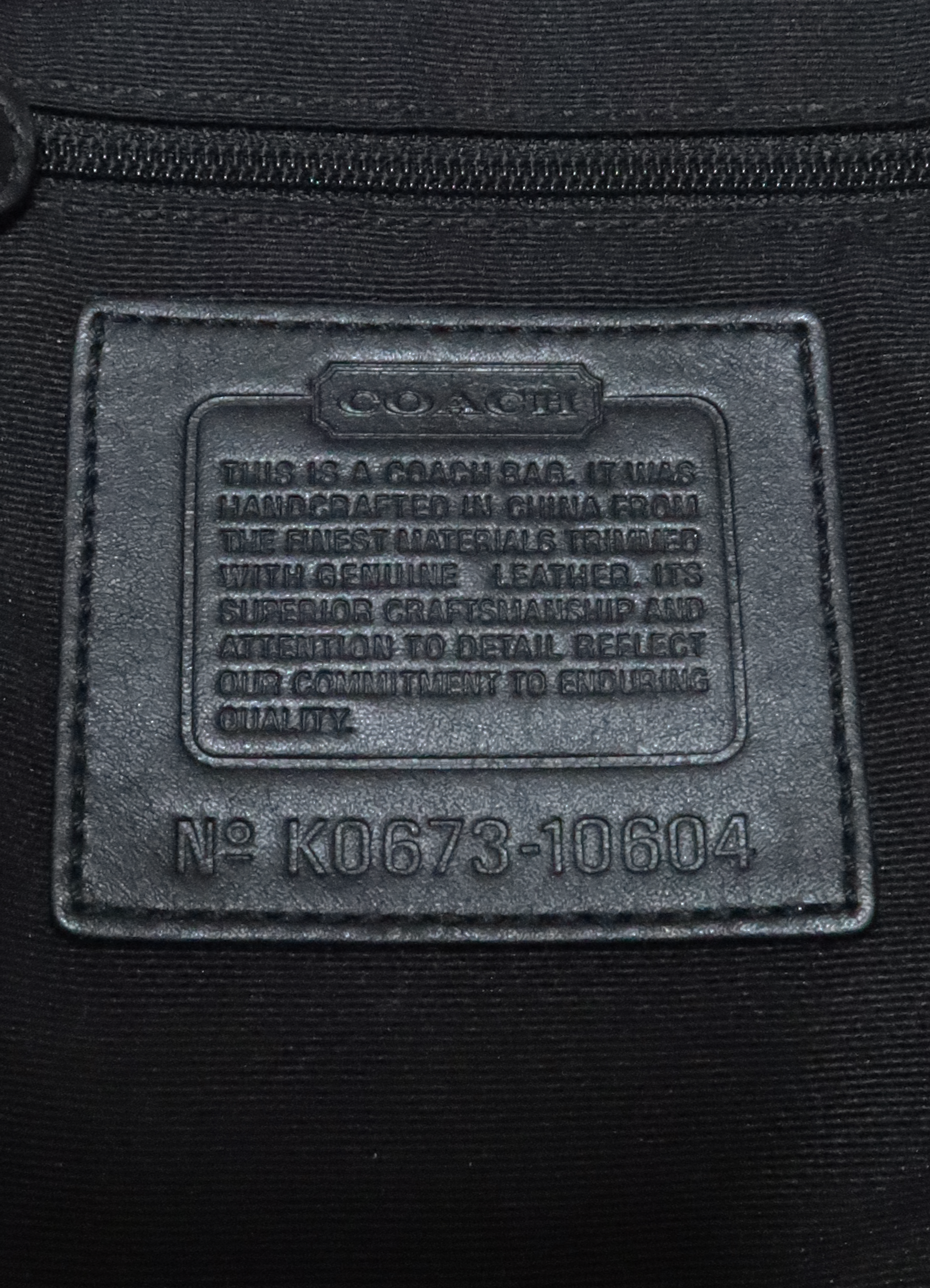 SIGNATURE SOHO POCKET SHOULDER BAG
