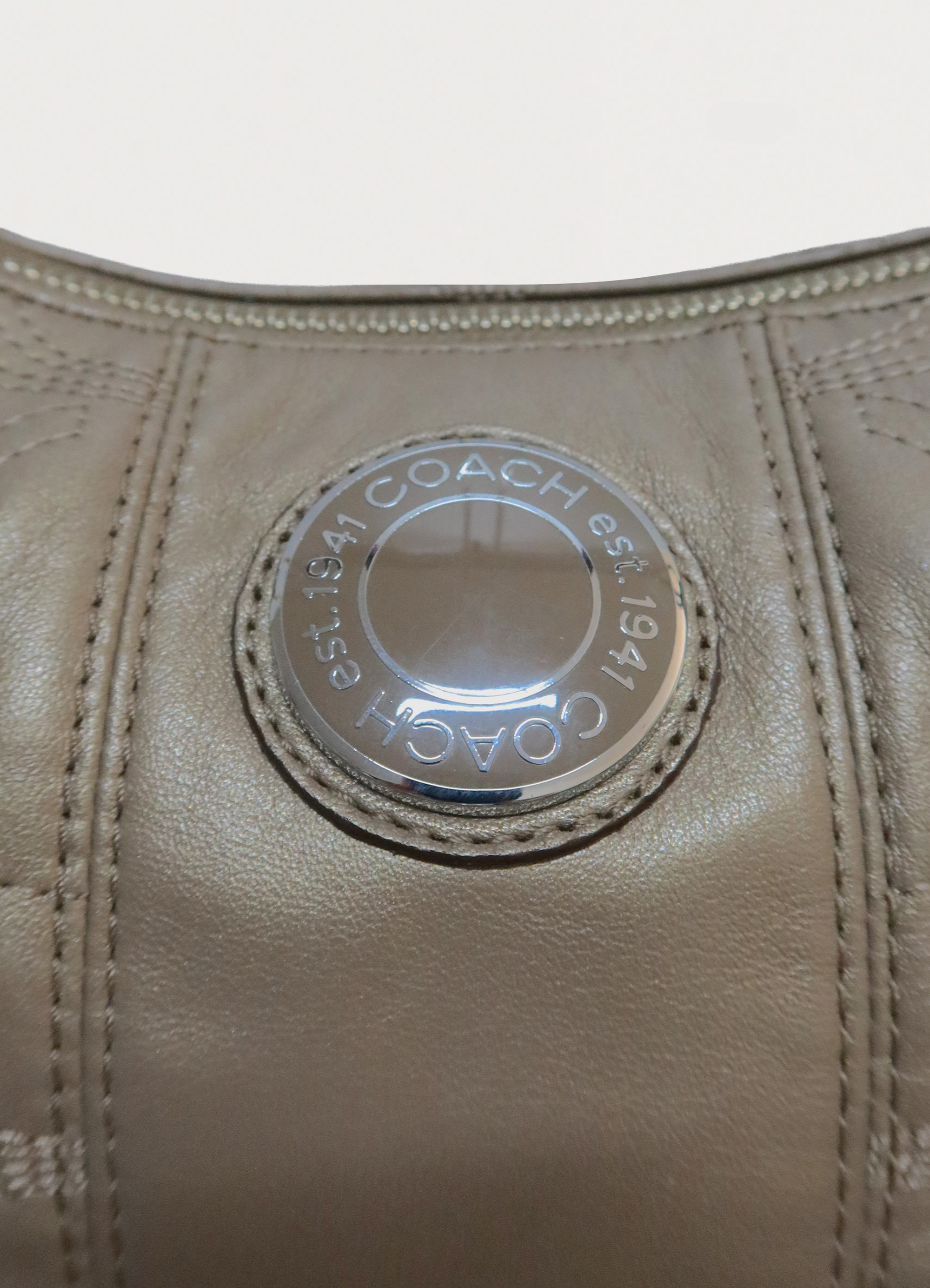 STITCHED SIGNATURE METALLIC HOBO SHOULDER BAG