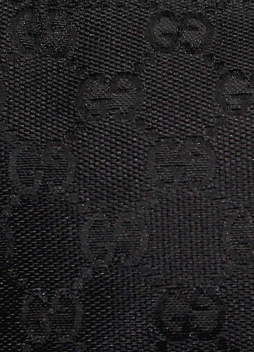 GG monogram boat back in black signature canvas with leather trim showing close up of print