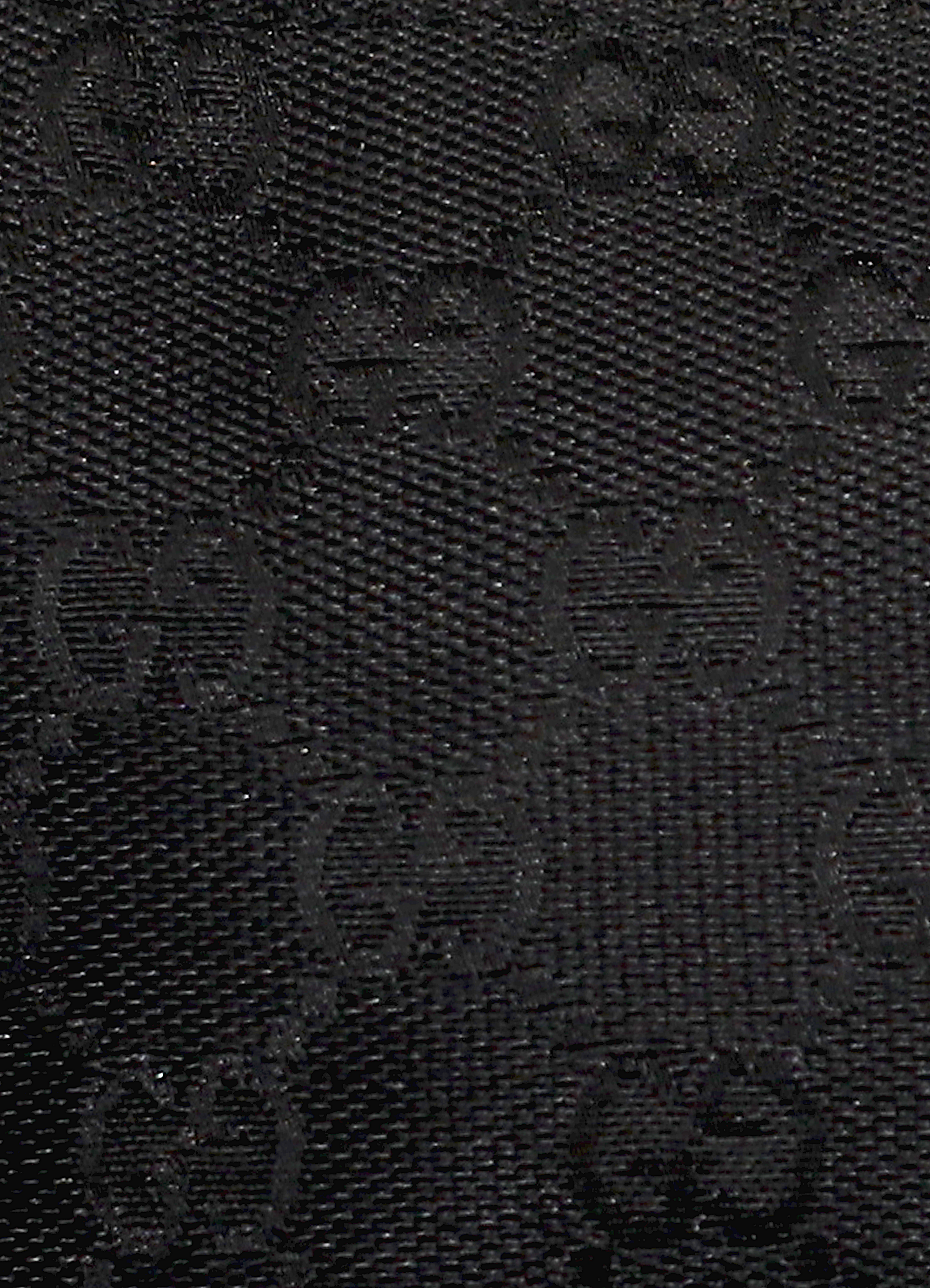 GG monogram boat back in black signature canvas with leather trim showing close up of print