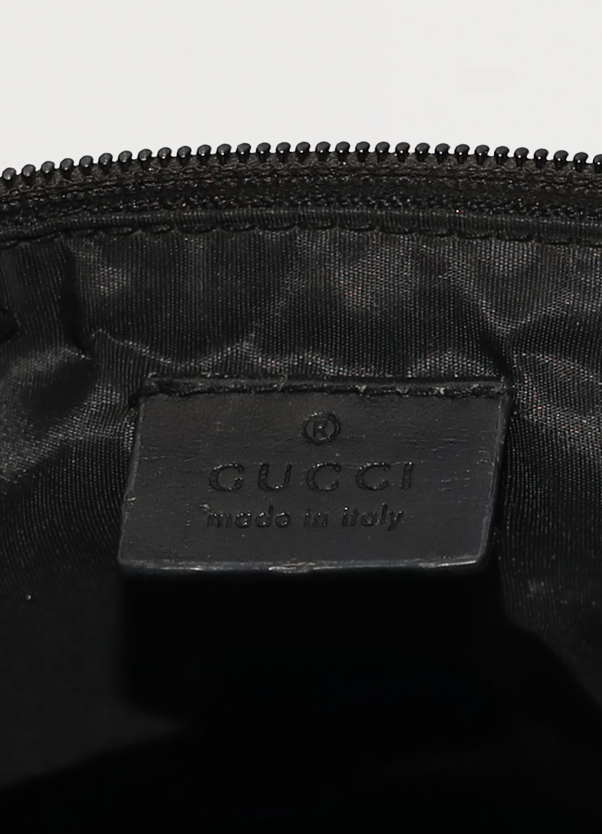GG monogram boat back in black signature canvas with leather trim showing label tag