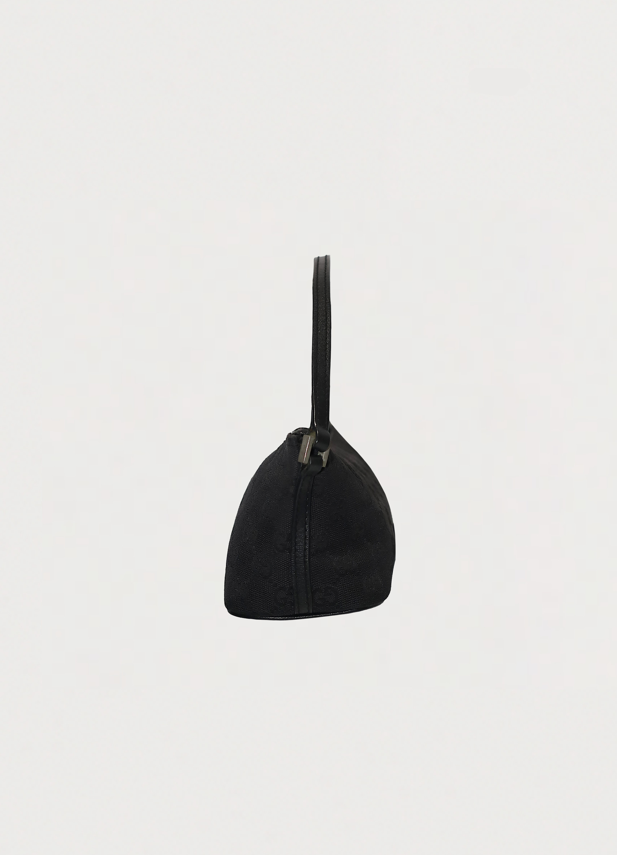 GG monogram boat back in black signature canvas with leather trim showing left side