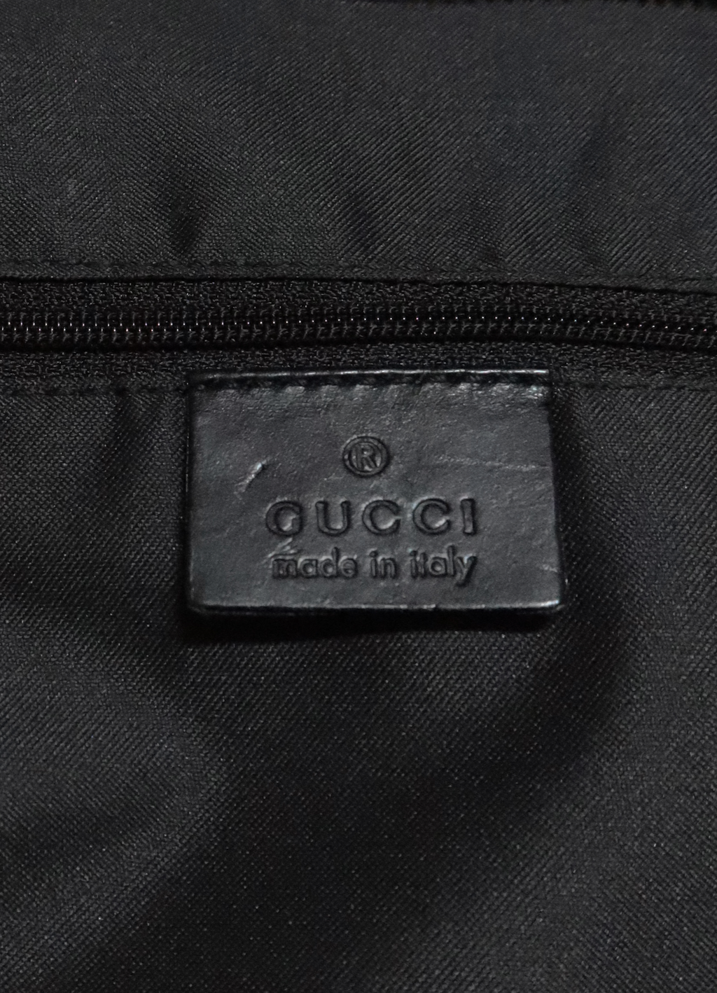 Interior leather Gucci Made in Italy logo heat stamp