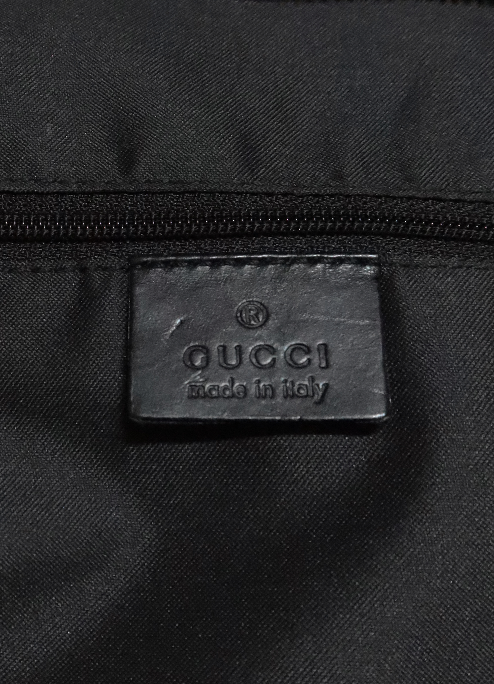 Interior leather Gucci Made in Italy logo heat stamp