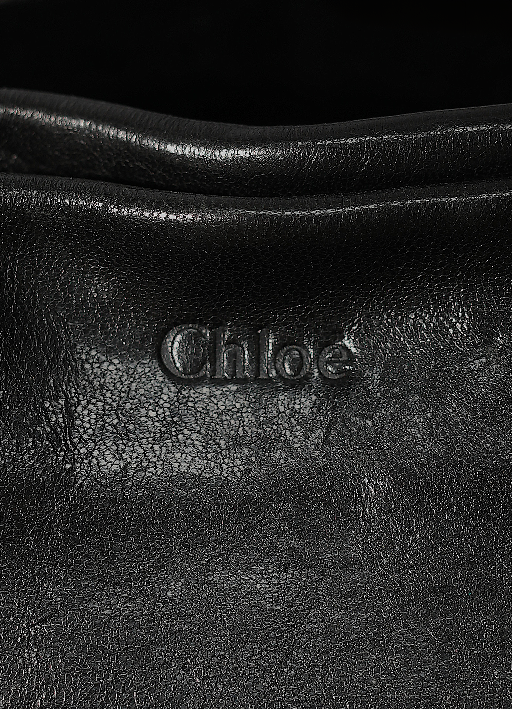 Vintage Chloe Heloise tote bag in black leather showing close up of embossed label