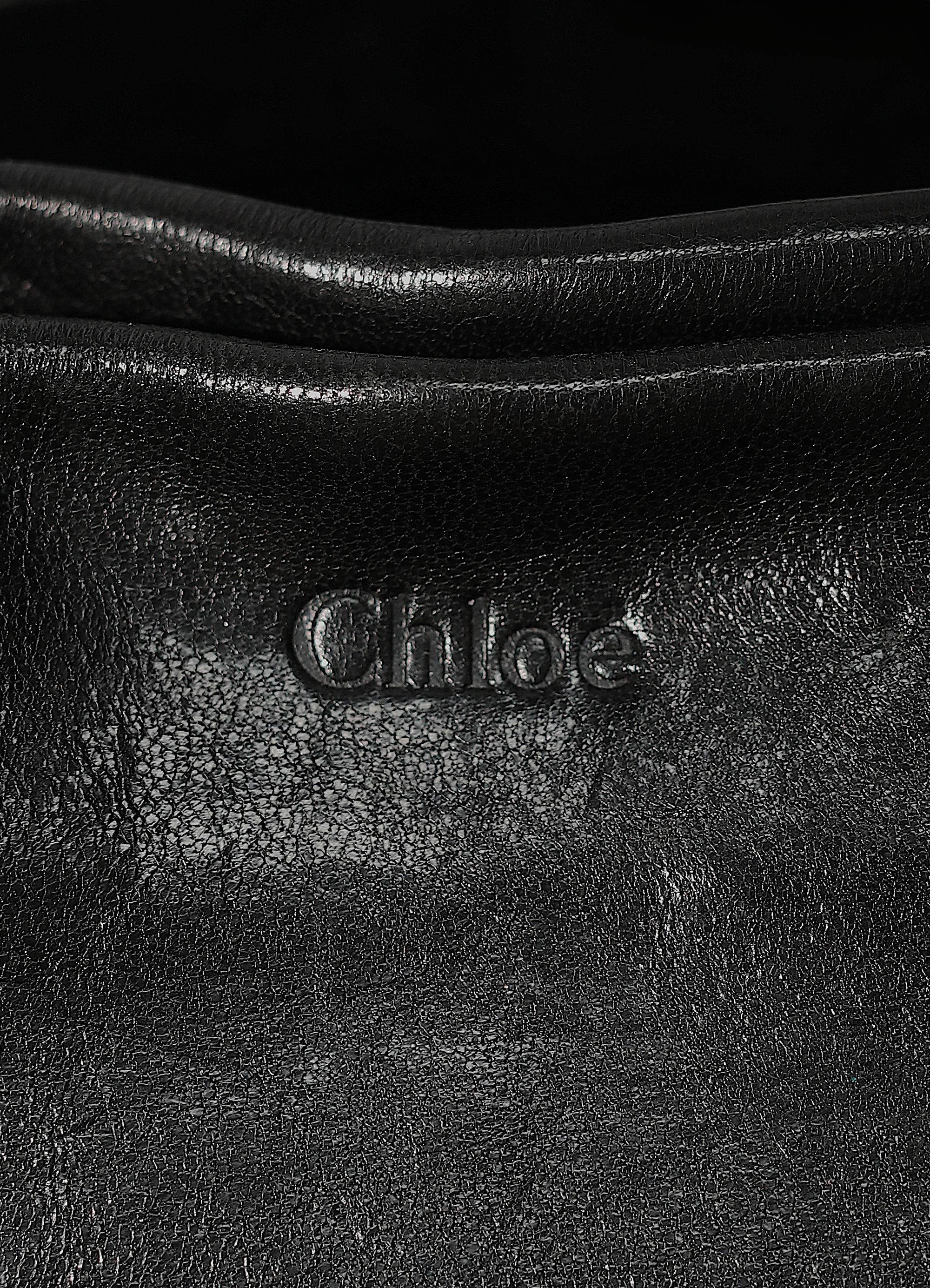 Vintage Chloe Heloise tote bag in black leather showing close up of embossed label