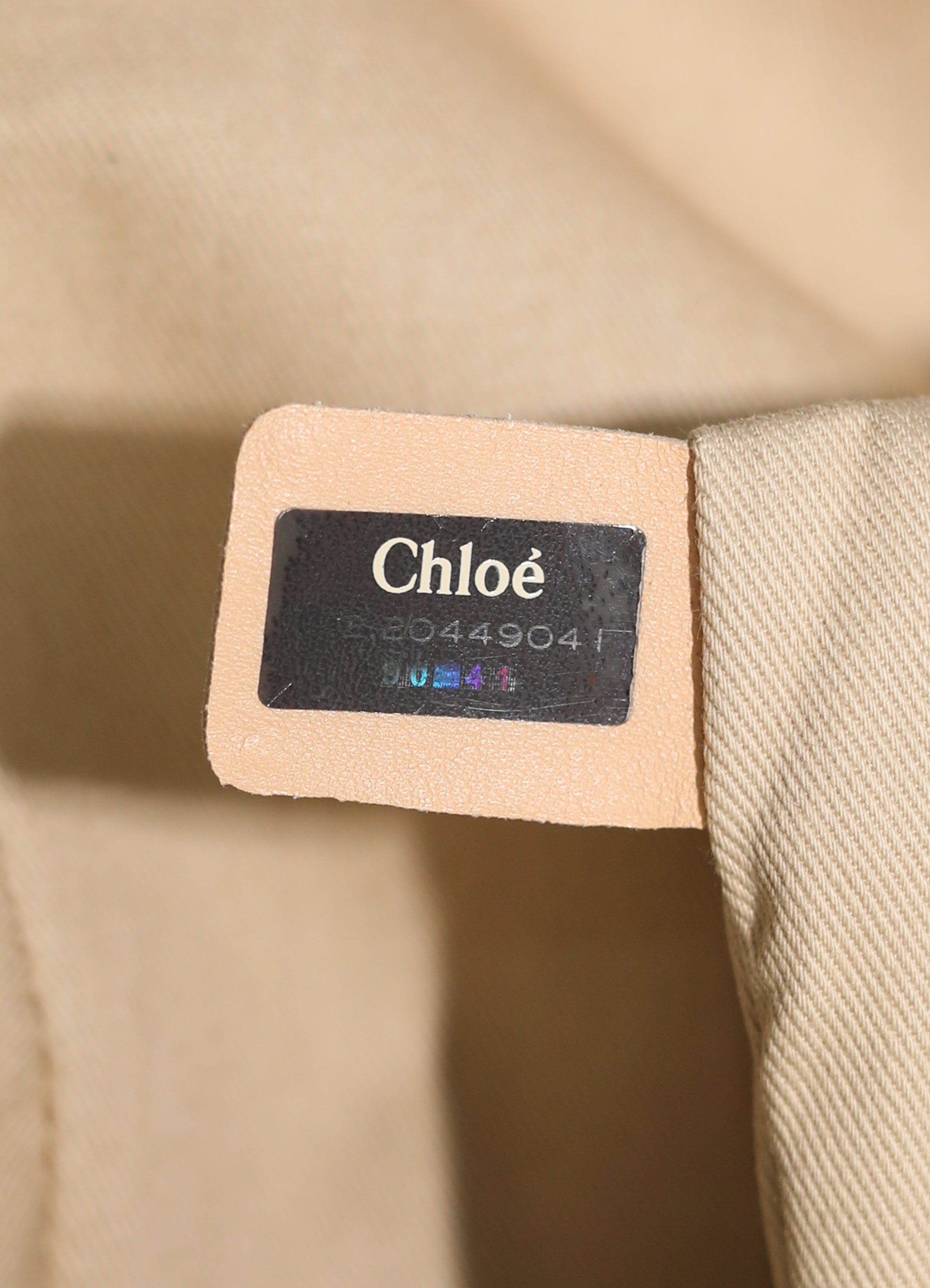 Vintage Chloe Heloise tote bag in black leather showing label and serial number