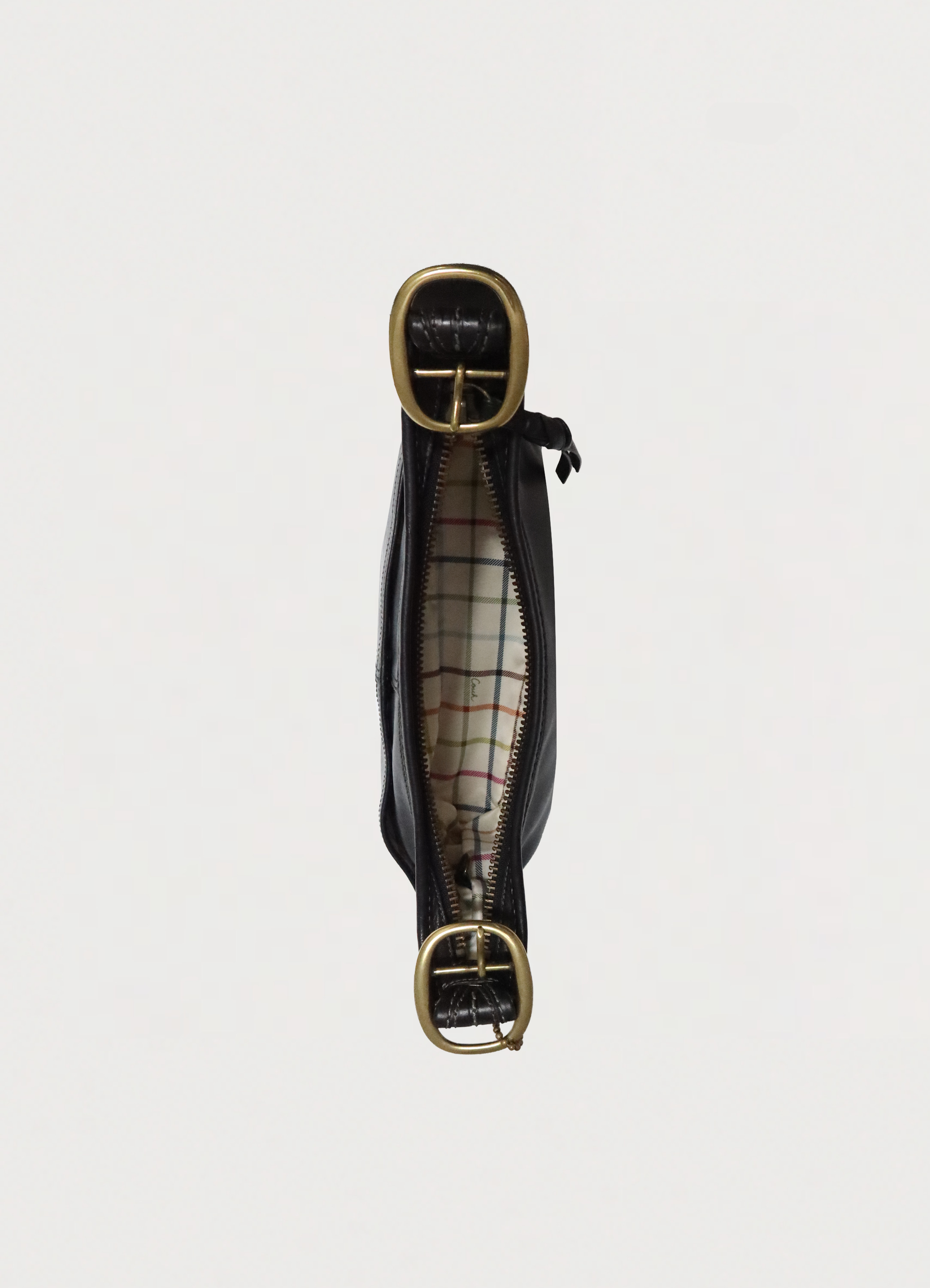 Top view of Coach Bleecker bag showing signature multi-color Tattersall plaid lining