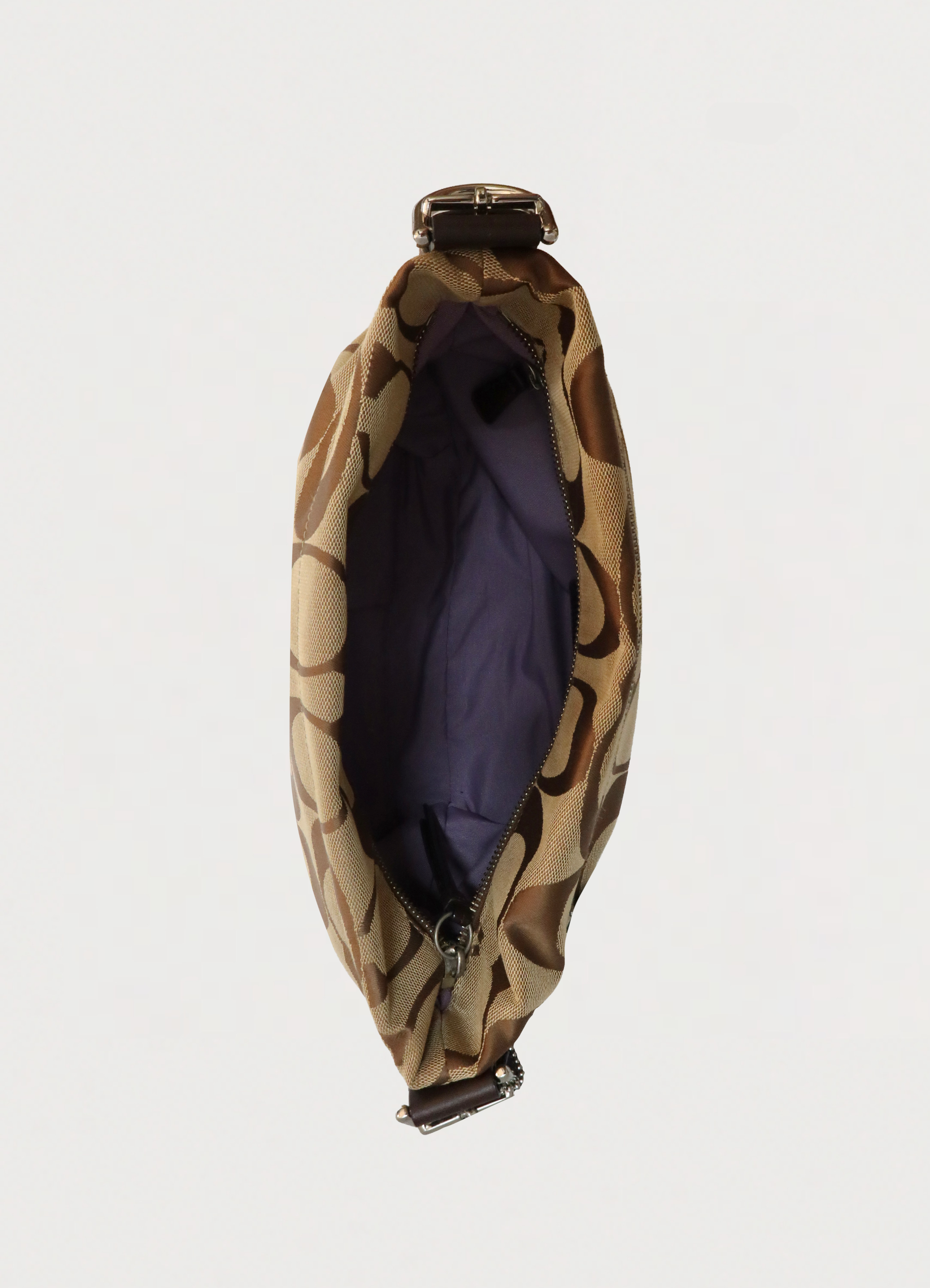 Top view of Coach Bleecker bag showing purple lining and interior compartment