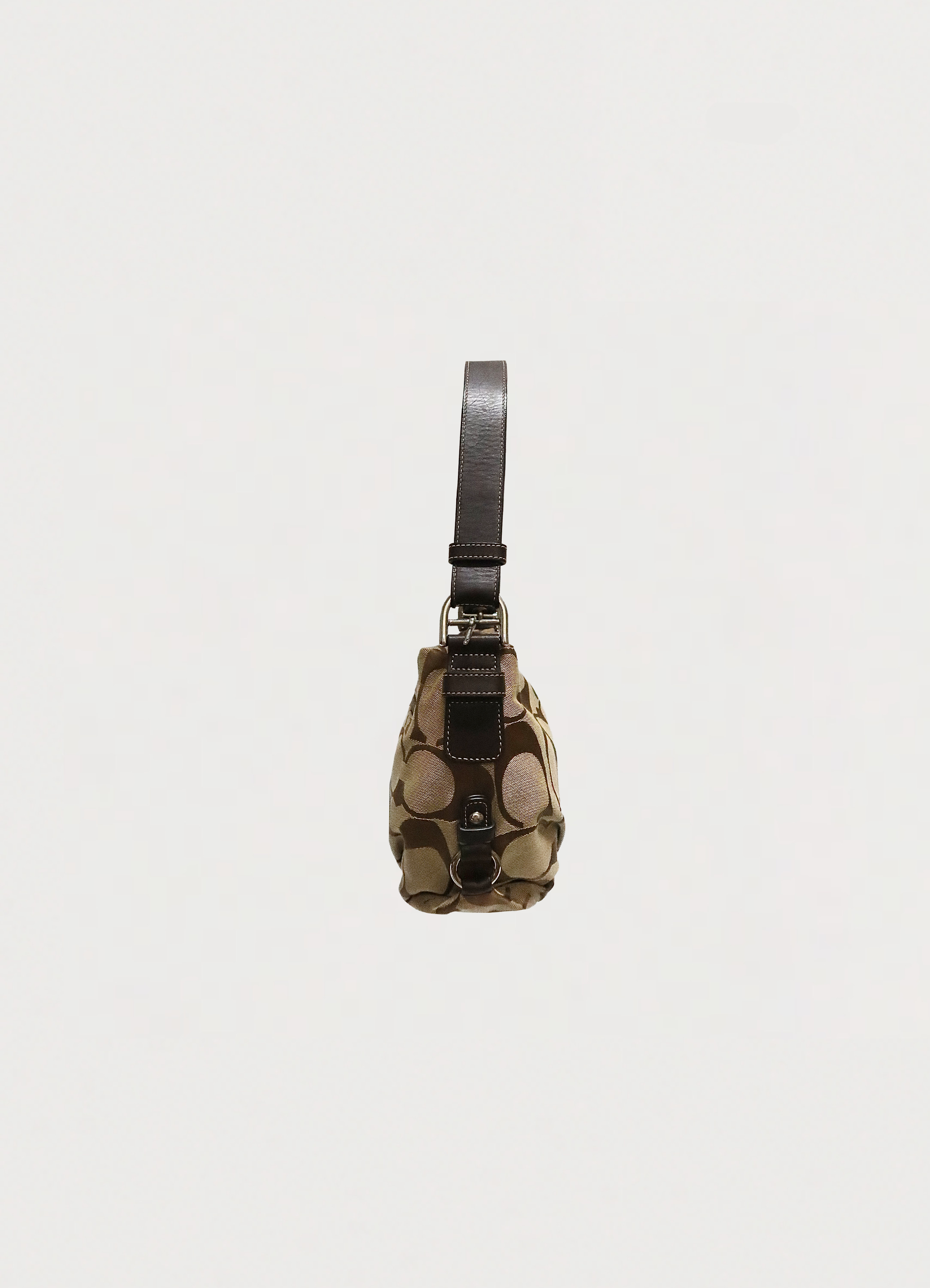 Right side profile of khaki Coach Bleecker signature hobo bag