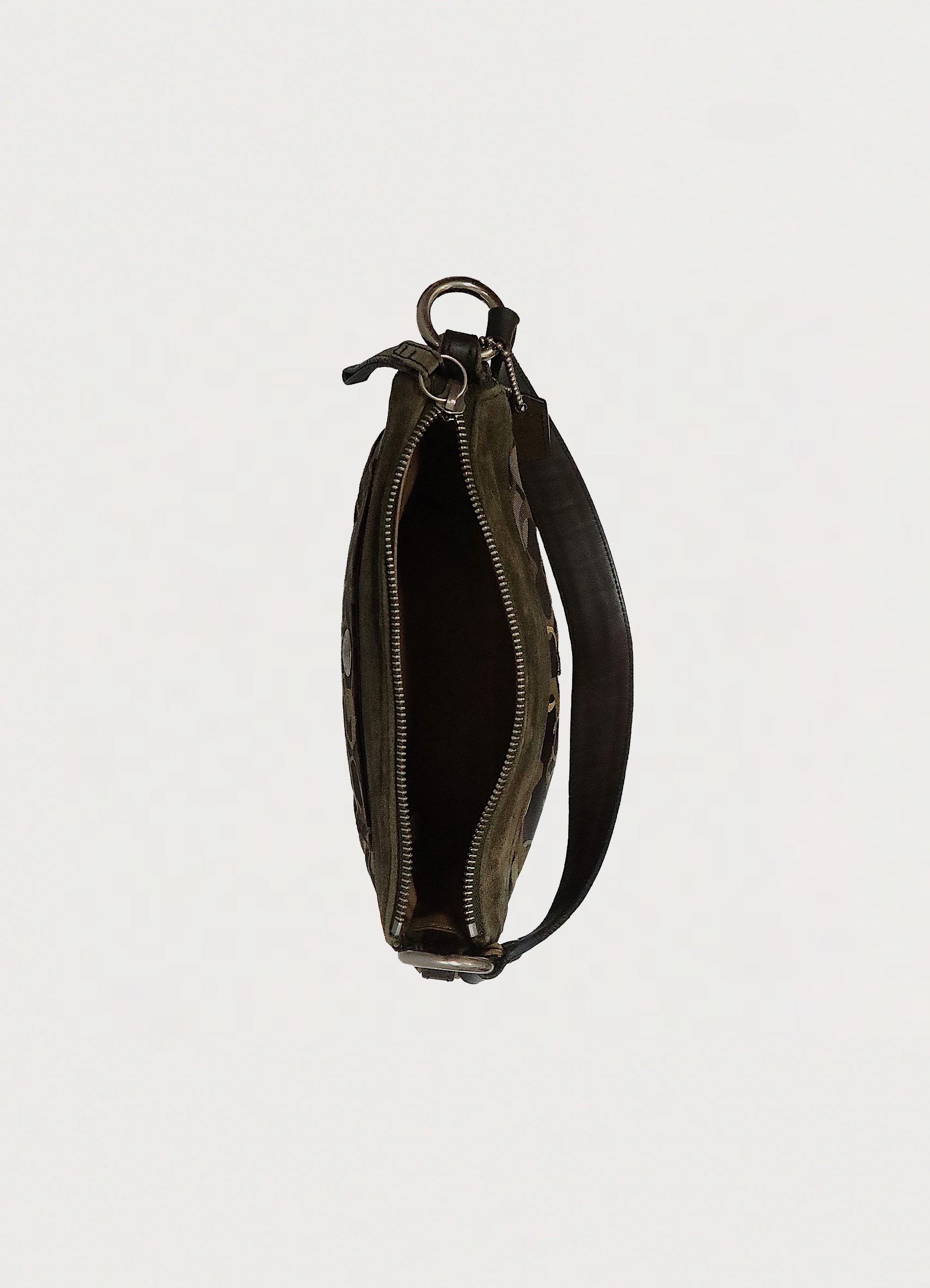 Top view of olive Coach bag showing interior compartment and zipper opening
