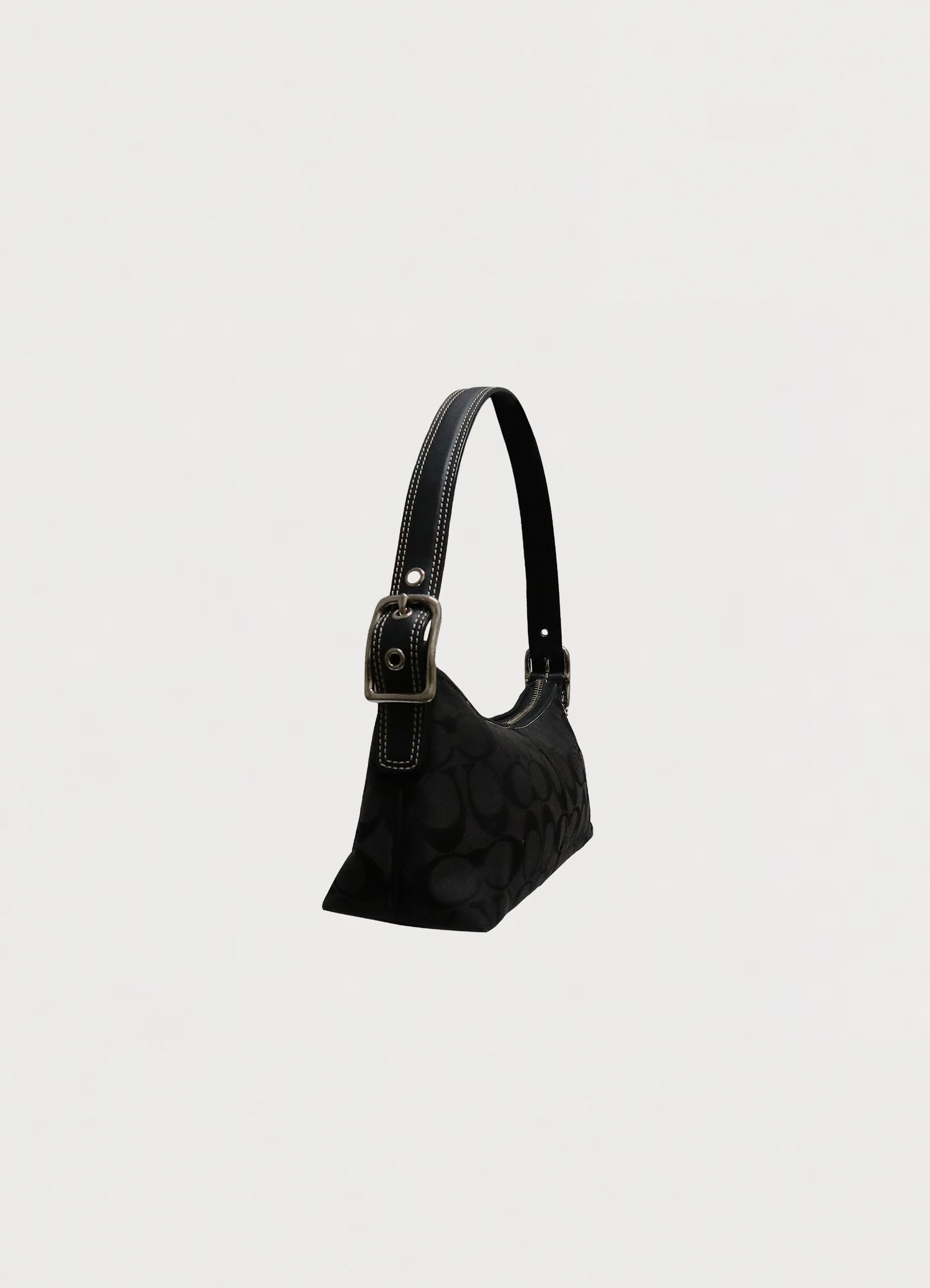 Vintage Coach East West demi baguette bag in black signature canvas angled side view