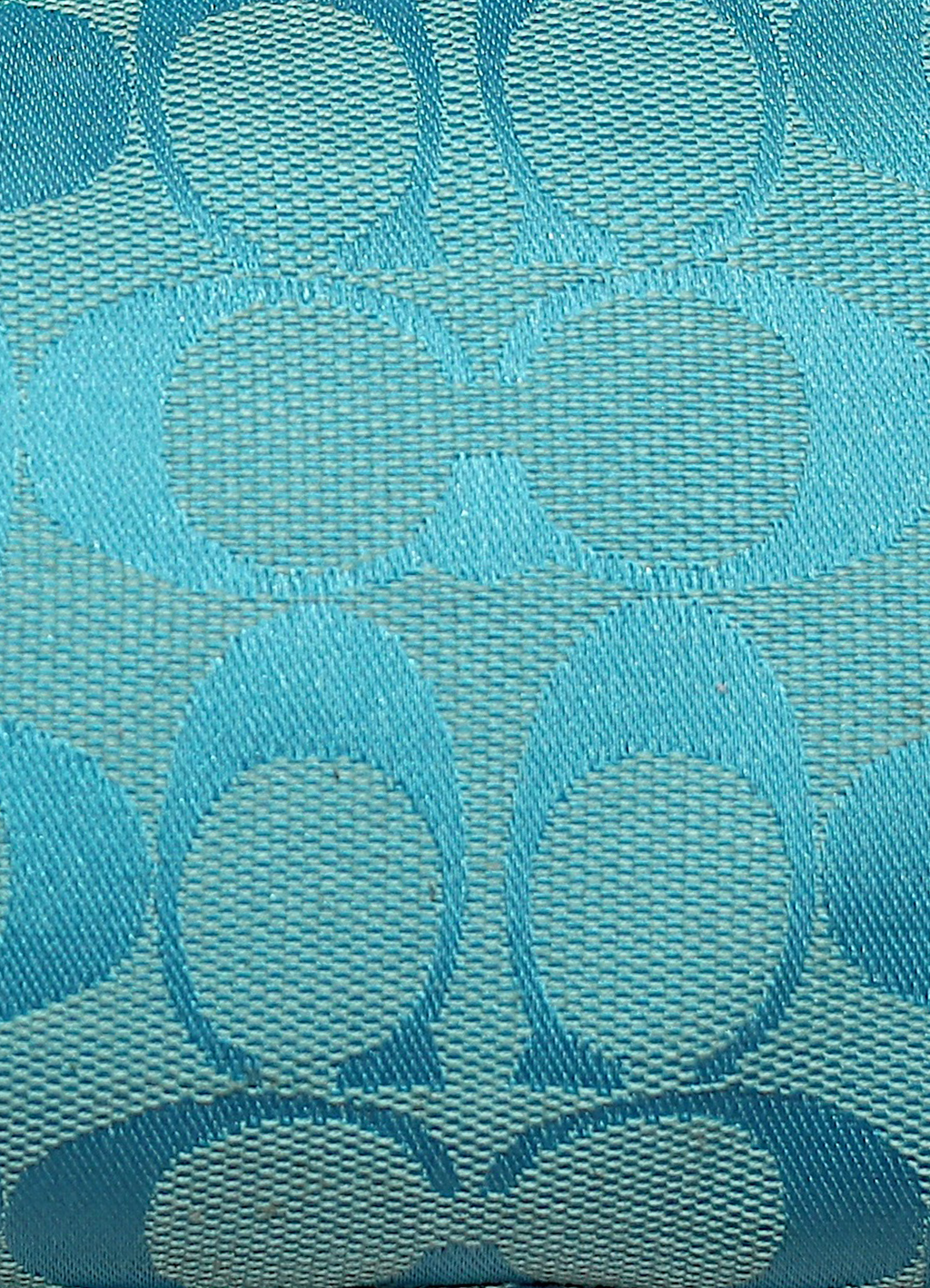 Vintage Coach East West demi bag in blue signature canvas with leather trim showing close up of print
