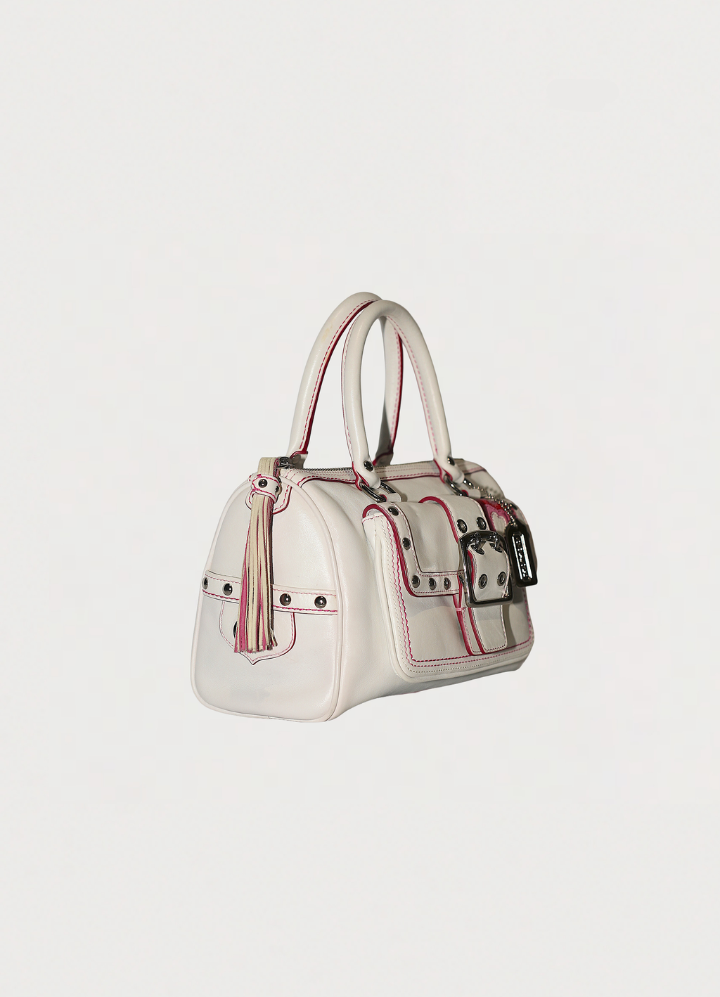 Vintage Coach embroidered heart satchel in leather with suede trim showing angled side