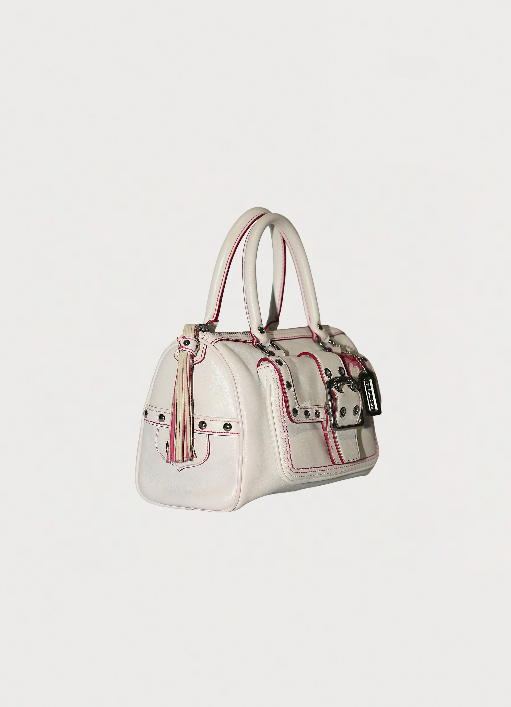 Vintage Coach embroidered heart satchel in leather with suede trim showing angled side