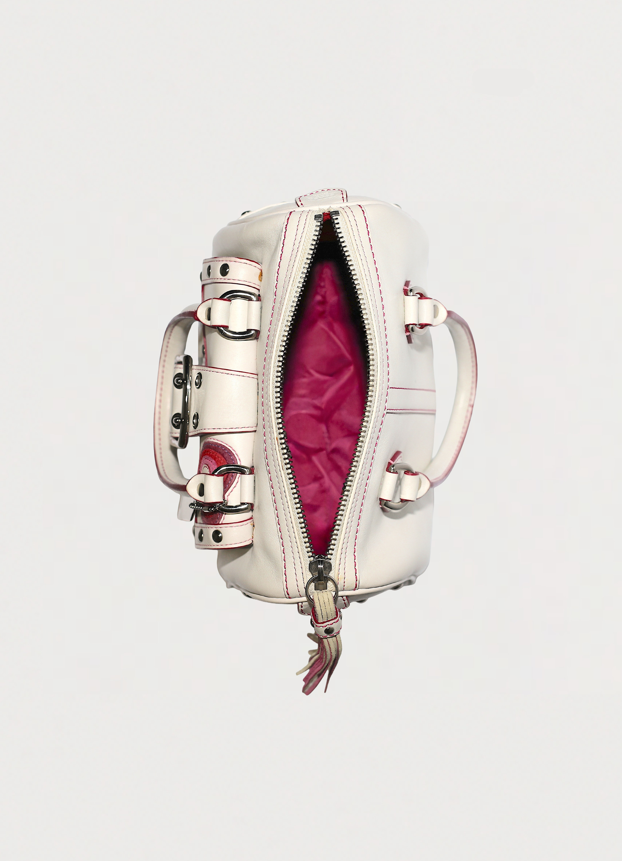 Vintage Coach embroidered heart satchel in leather with suede trim showing interior from top view