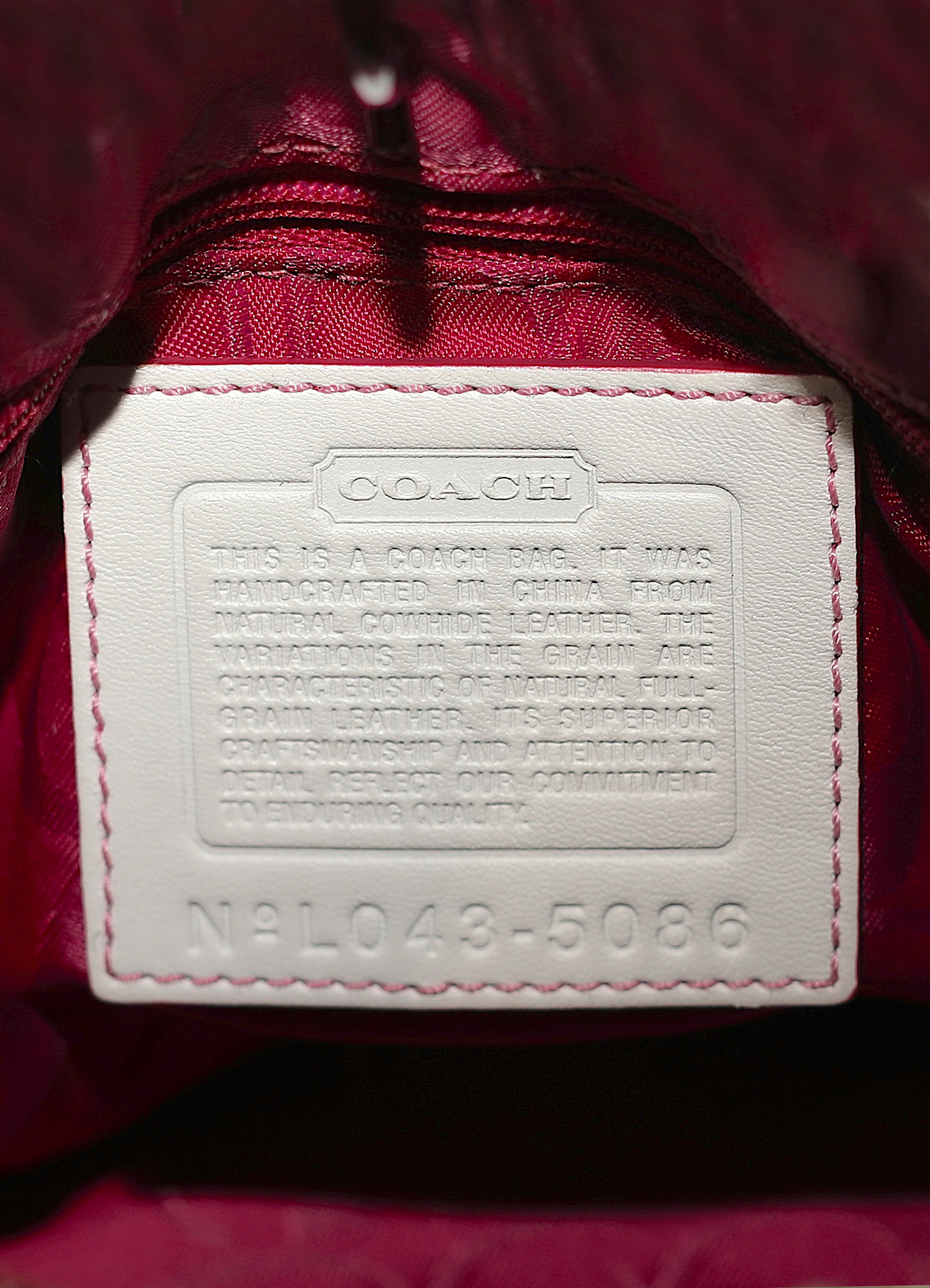 Vintage Coach embroidered heart satchel in leather with suede trim showing creed patch