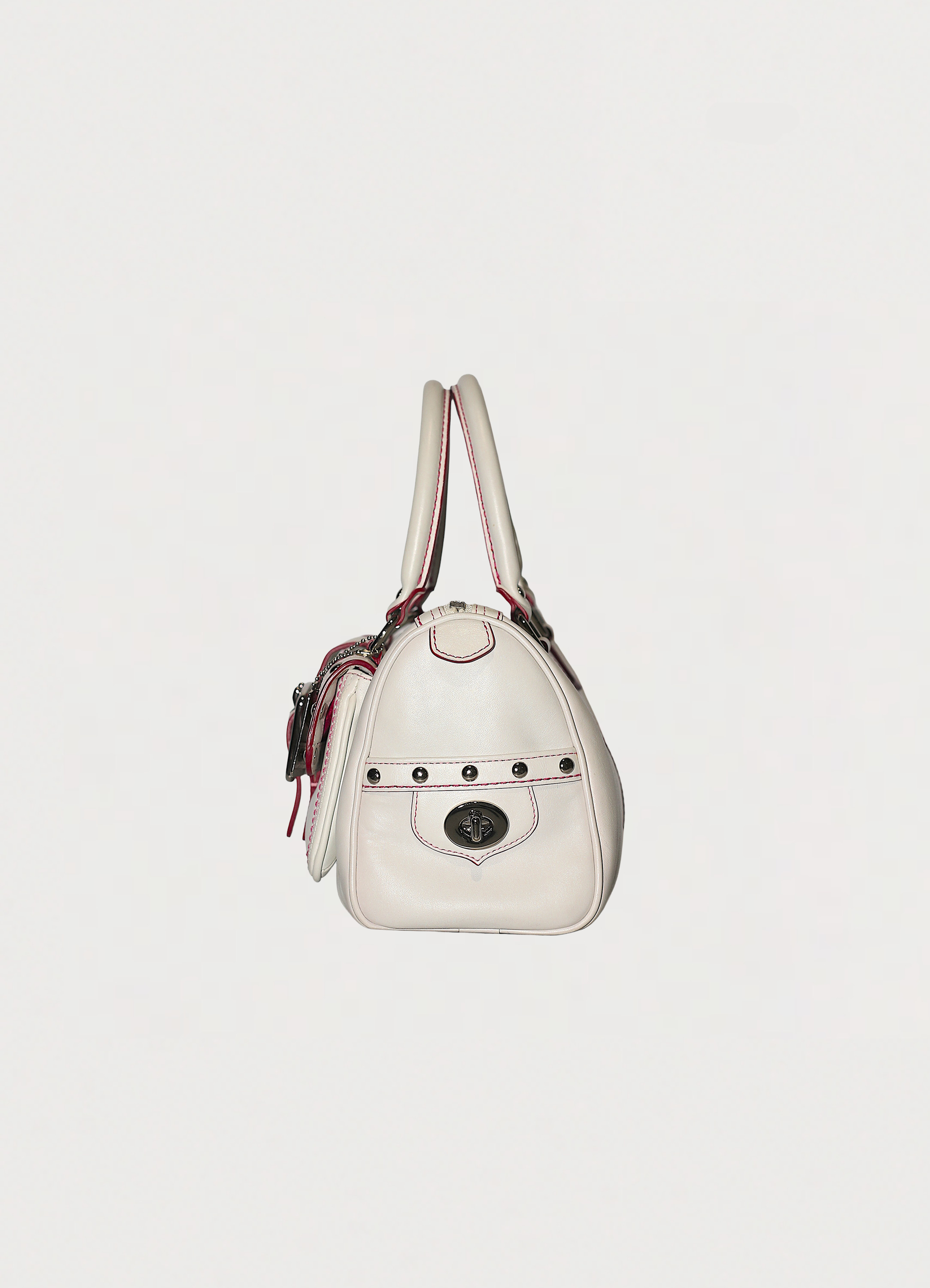 Vintage Coach embroidered heart satchel in leather with suede trim showing left side