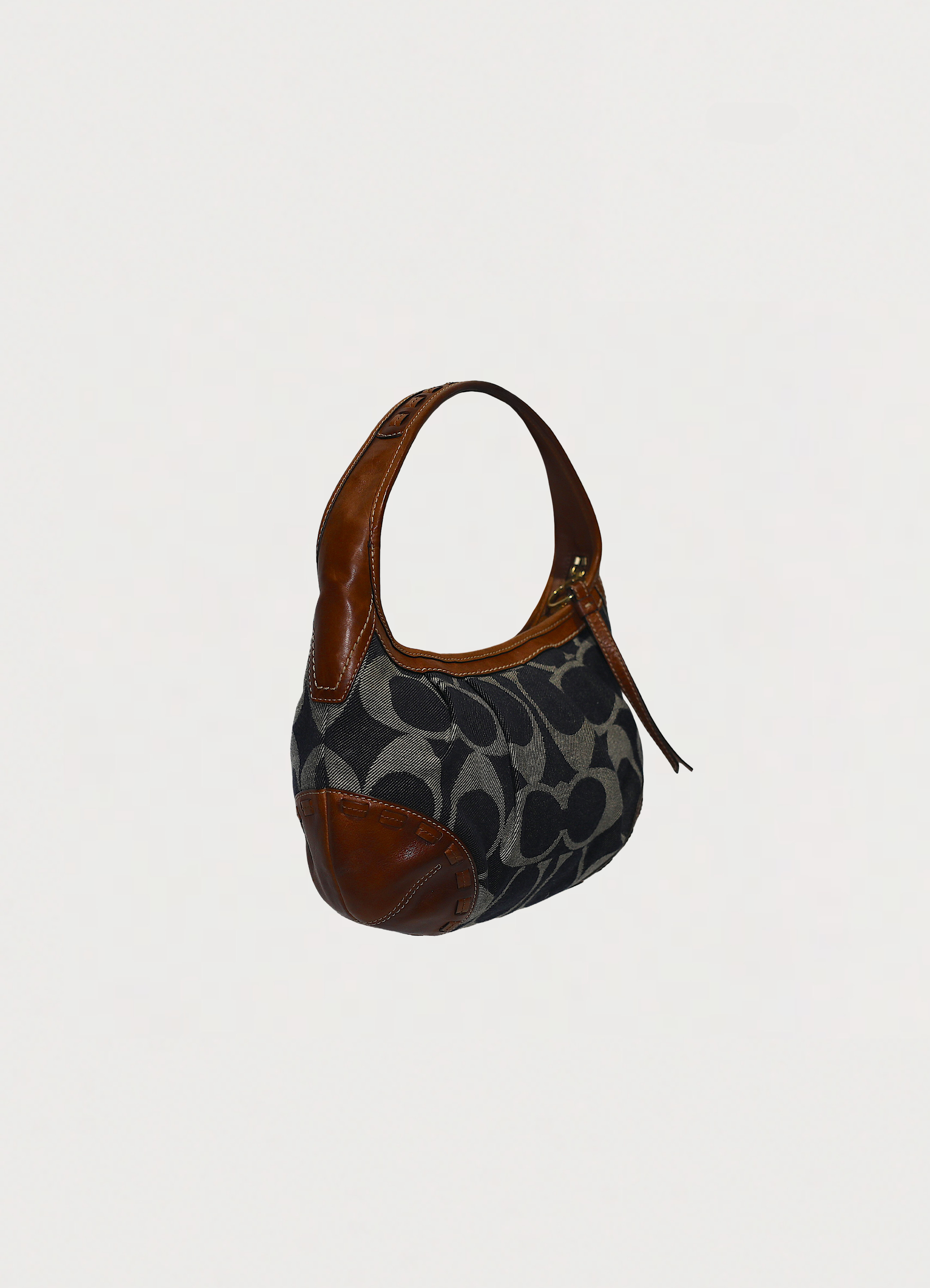 Vintage Coach Ergo monogram hobo in blue signature canvas with leather trim showing angled side