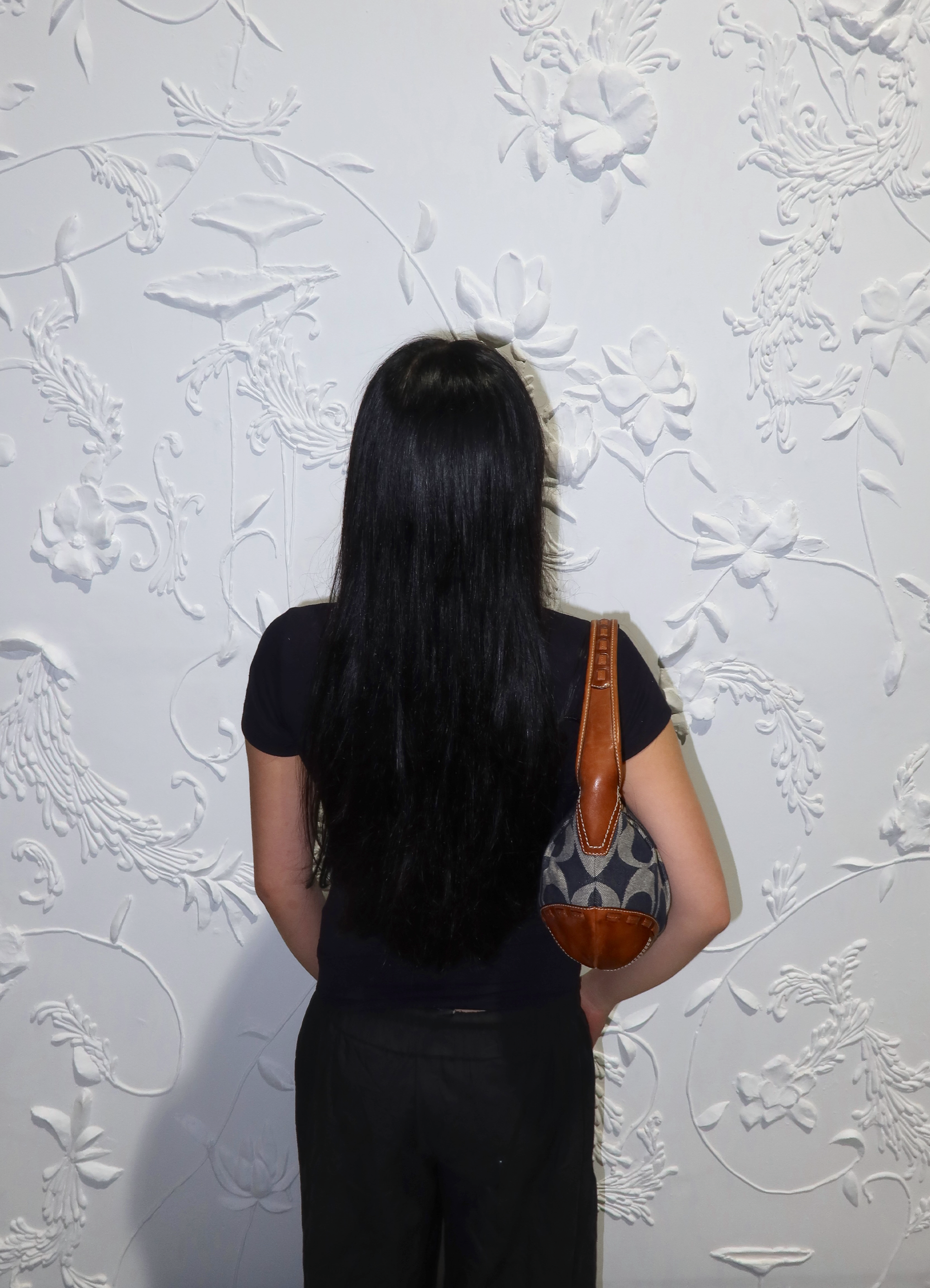 Coach Ergo hobo bag worn on shoulder by model