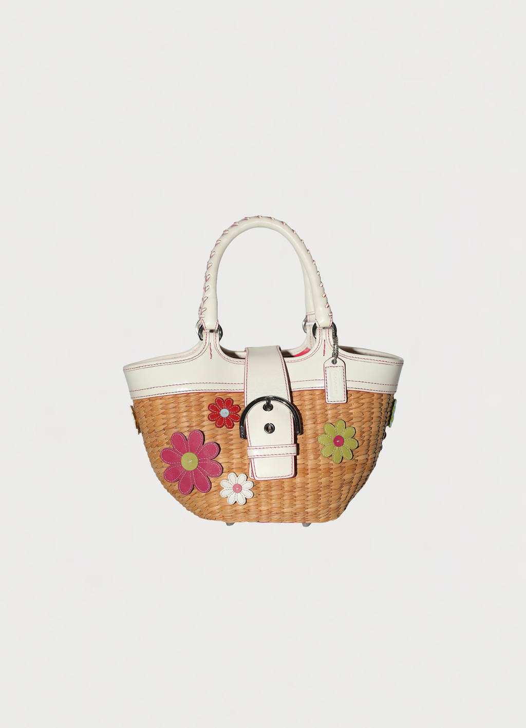 Vintage Coach Flowered straw handbag in white leather trim showing front side
