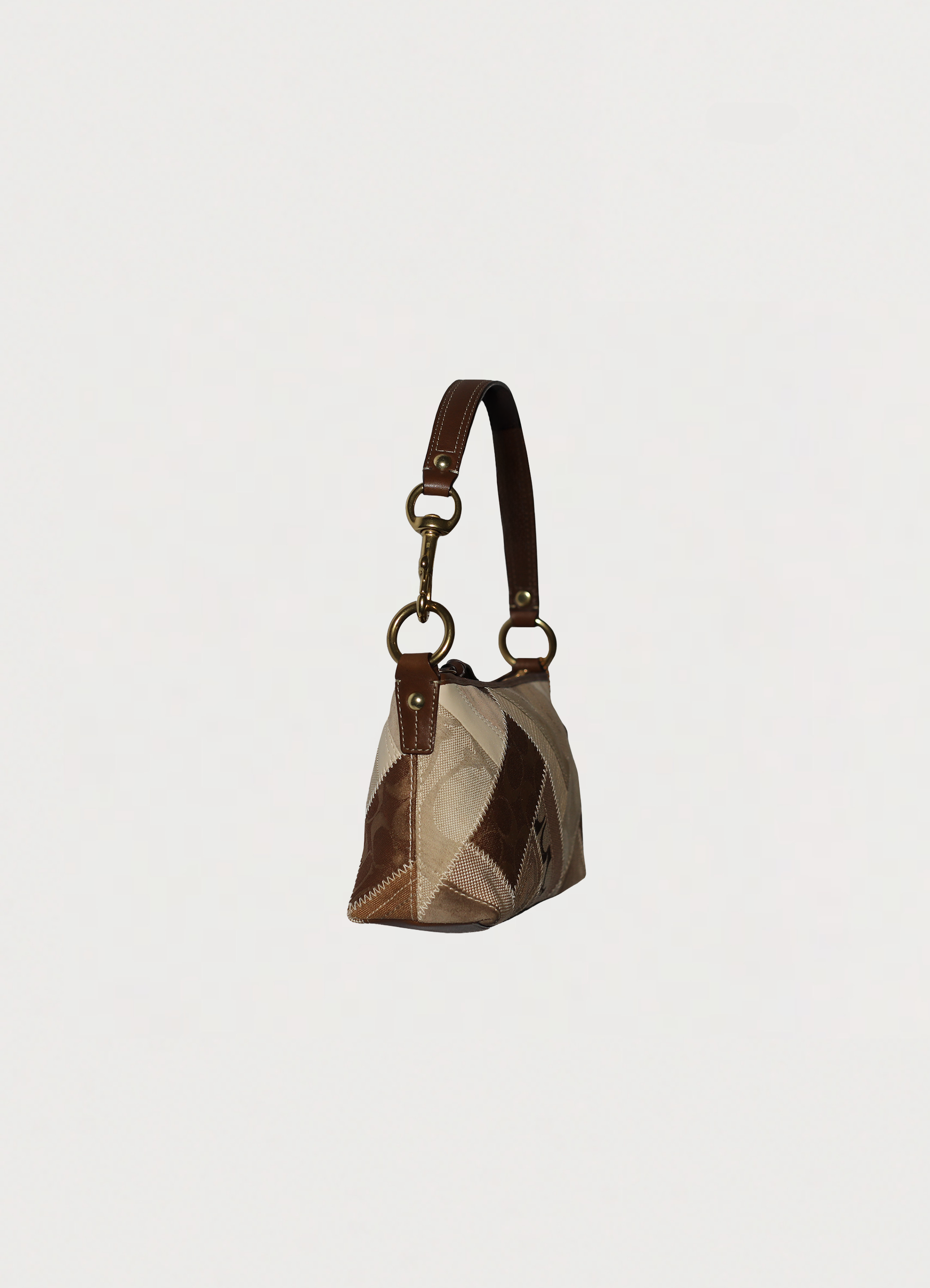 Vintage Coach Hamptons baguette bag in brown signature canvas with leather trim
showing angled side