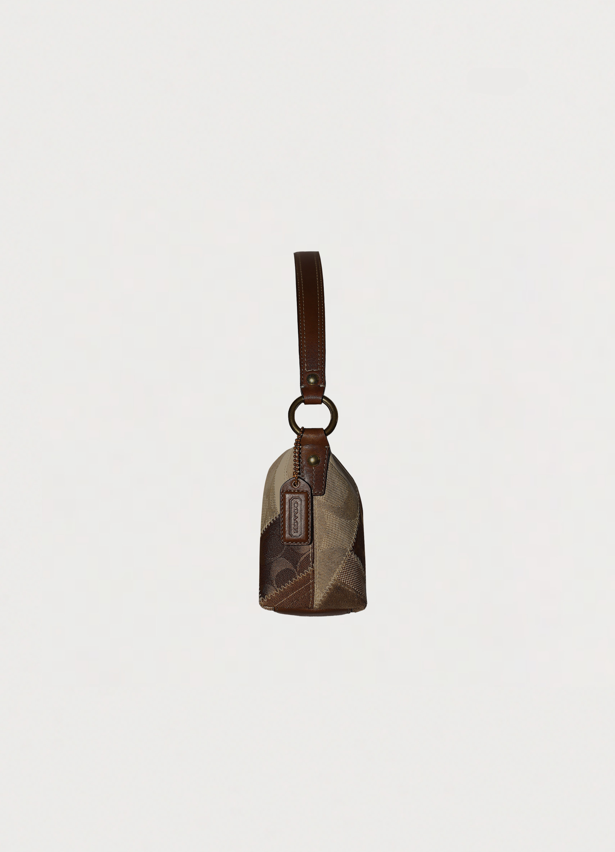 Vintage Coach Hamptons baguette bag in brown signature canvas with leather trim
showing left side