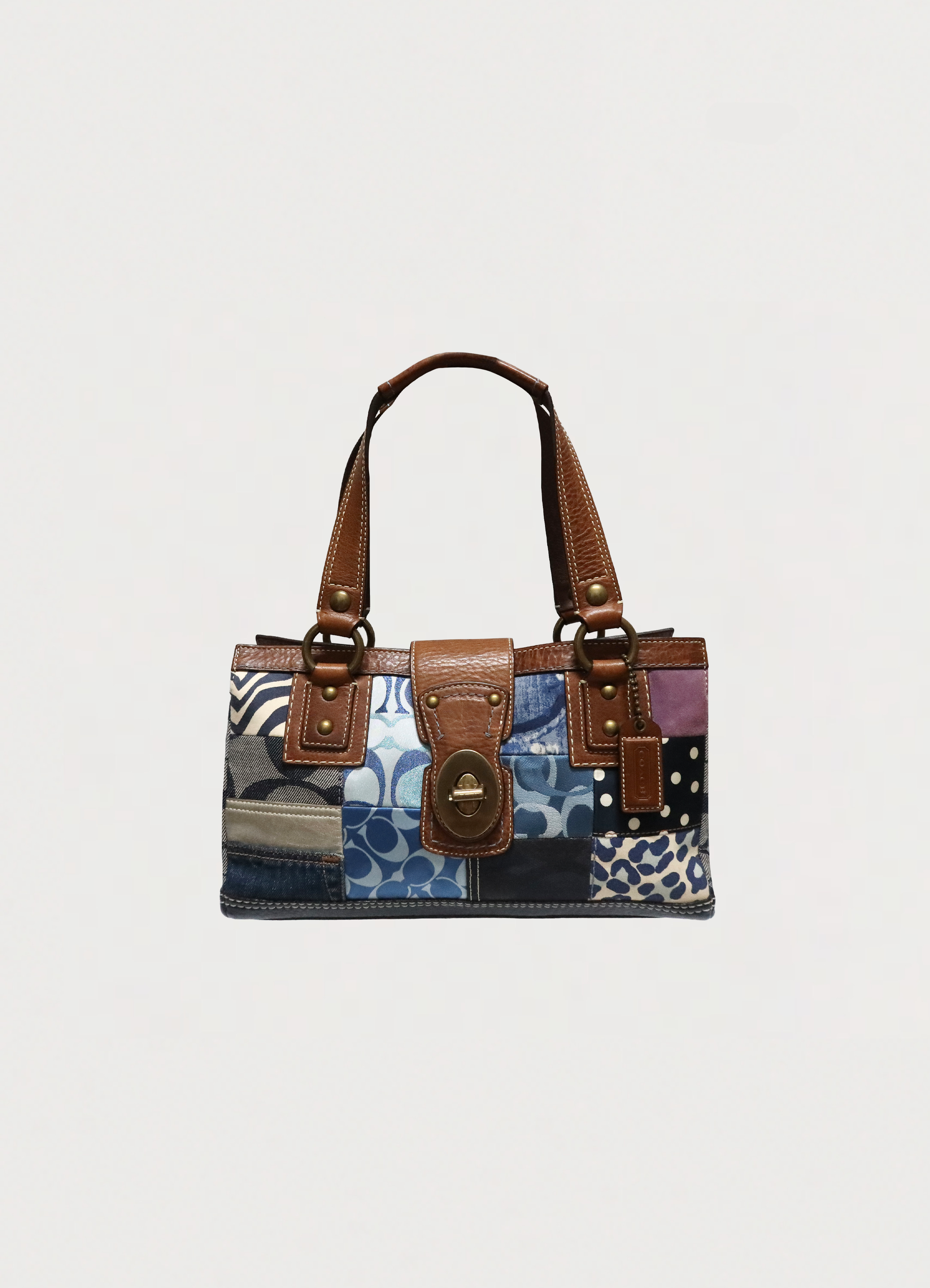 Vintage Coach Hamptons patchwork satchel featuring denim, leopard print, and metallic leather front view