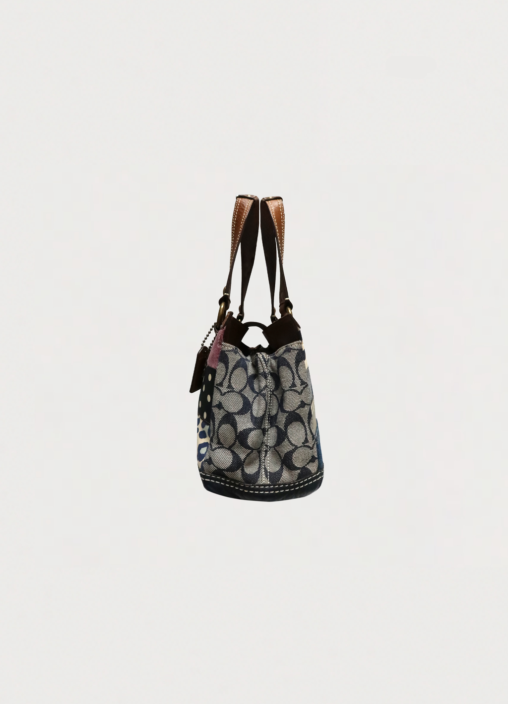 Right side profile of Coach Hamptons patchwork satchel bag